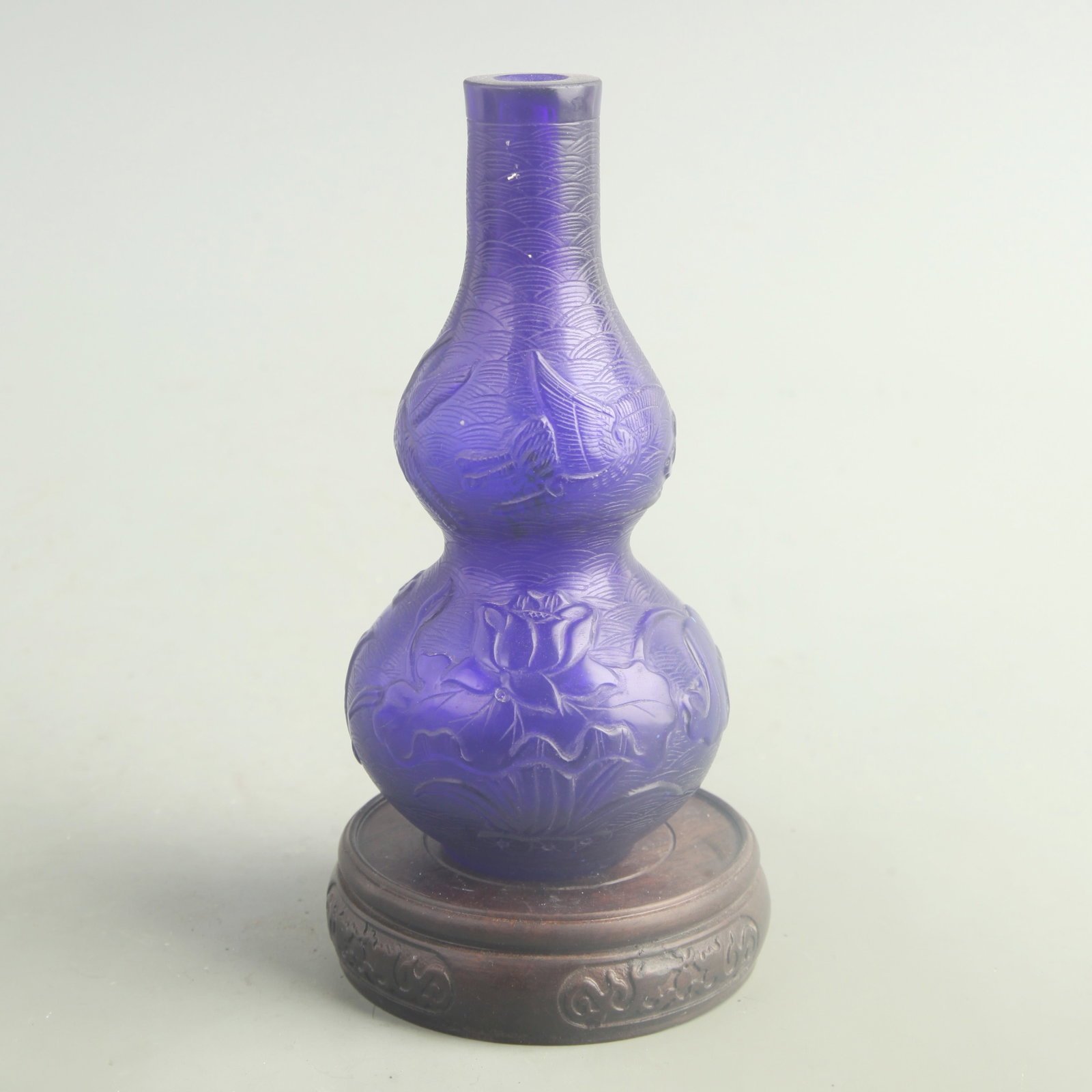 BLUE GOURD GLASS VASE WITH LOTUS AND FISH PATTERNS: Qing Dynasty; High: 7.00 inch; Diameter: 3.00 inch; wooden base for picture and display purpose only.