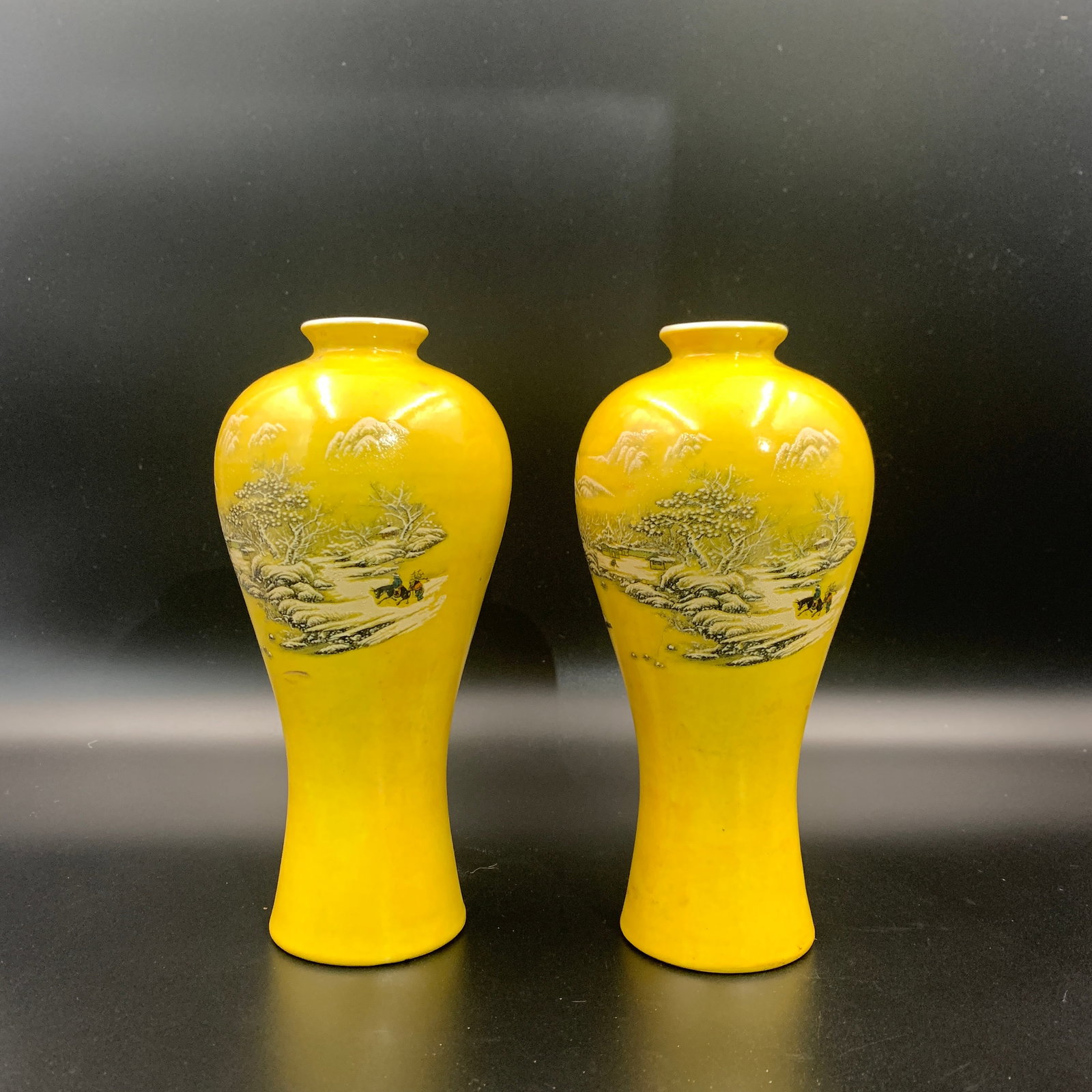 A PAIR OF CHINESE MONOCHROME YELLOW-GROUND MOLDED LIME-GREEN 'LANDSCAPE' VASES (MEIPING): Qing Dynasty; High: 8.2 inch; Diameter: 3.9 inch;