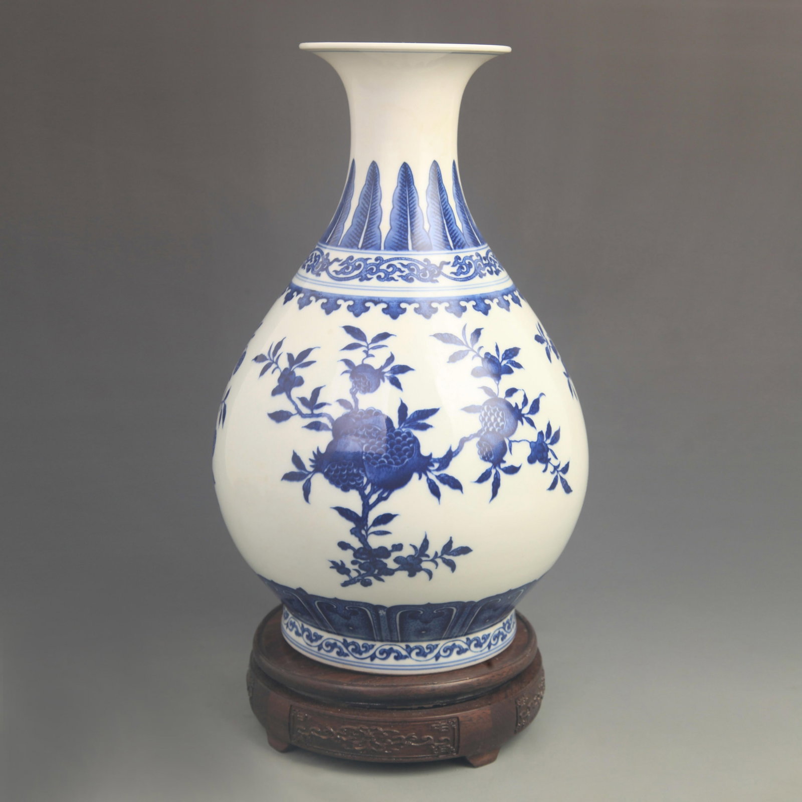 BLUE AND WHITE HAPPINESS AND LONGEVITY PATTERN PORCELAIN BOTTLE: Qing Dynasty Qian Long Period; High: 12.8 inch; Diameter: 7.50 inch; wooden base for picture and display purpose only.