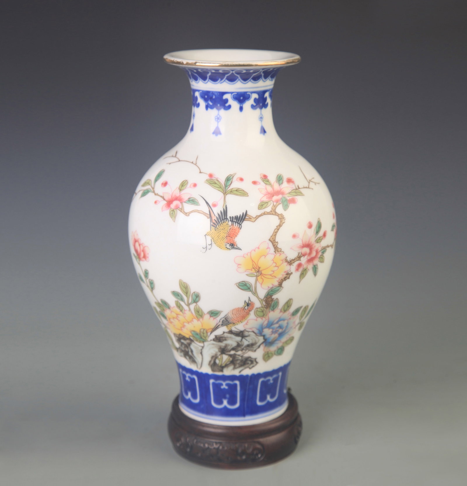 RARE BLUE AND WHITE FAMILLE ROSE GUAN YIN STYLE VASE: Qing Dynasty Qian Long Period; High: 9.0 inch; Diameter:3.25 inch; wooden base for picture and display purpose only.