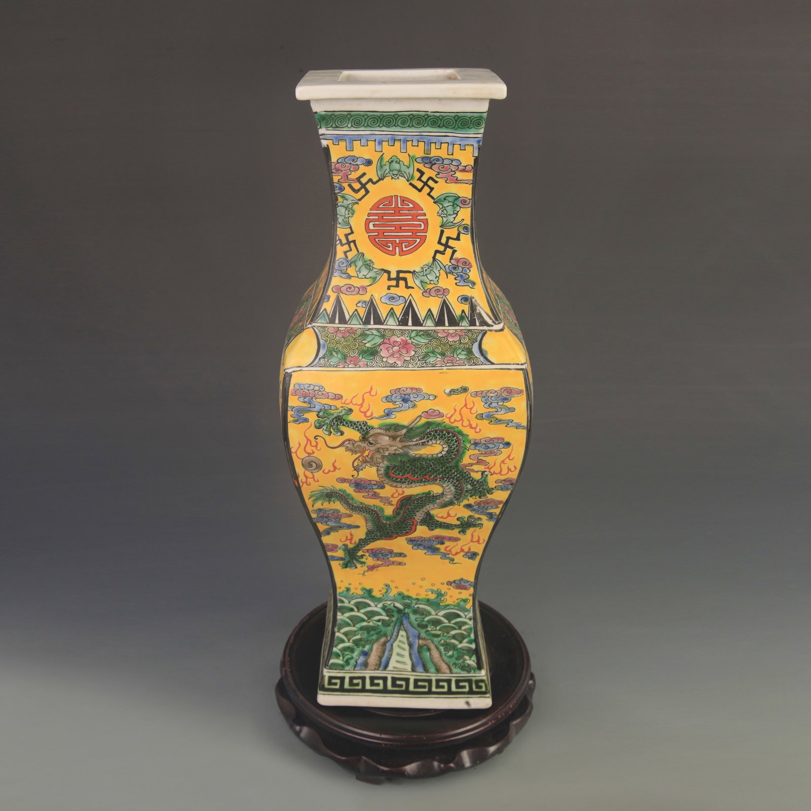 FAMILLE ROSE SQUARE VASE WITH YELLOW GROUND AND DRAGON PATTERN: Qing Dynasty Kang Xi Period; Diameter: 7.30 inch; Width: 5.70 inch; wooden base for picture and display purpose only.