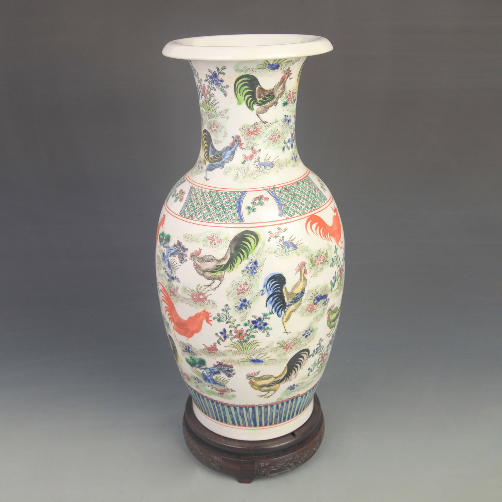 A FINE FAMILLE ROSE CHICKEN PATTERN PORCELAIN VASE: Qing Dynasty; High: 16.0 inch; Diameter: 6.7 inch; wooden base for picture and display purpose only.