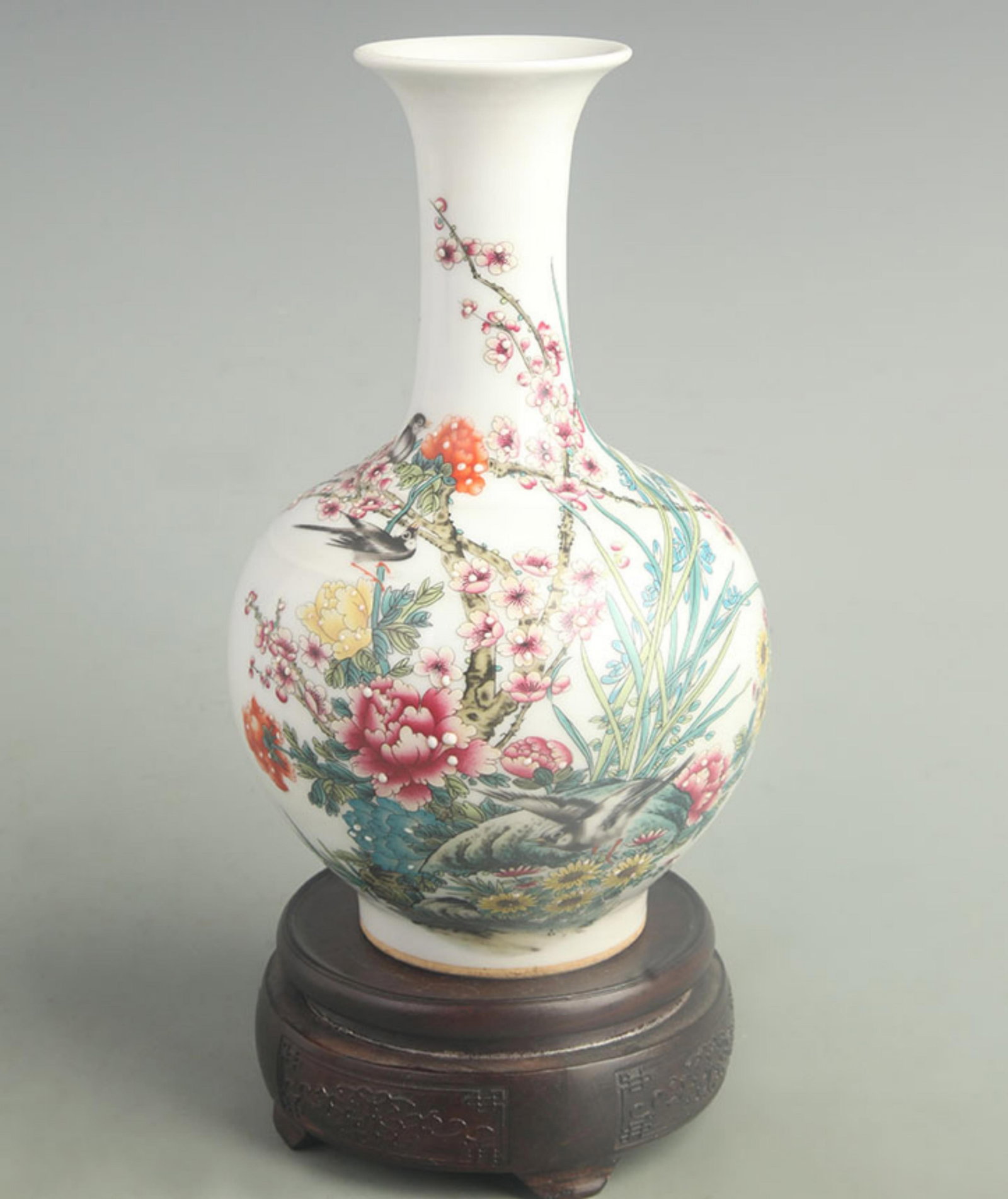 FAMILLE ROSE MAGPIE AND PLUM BLOSSOM PRESENTATION VASE: Qing Dynasty Qian Long Period; High: 9.00 inch; Width: 5.00 inch; wooden base for picture and display purpose only.