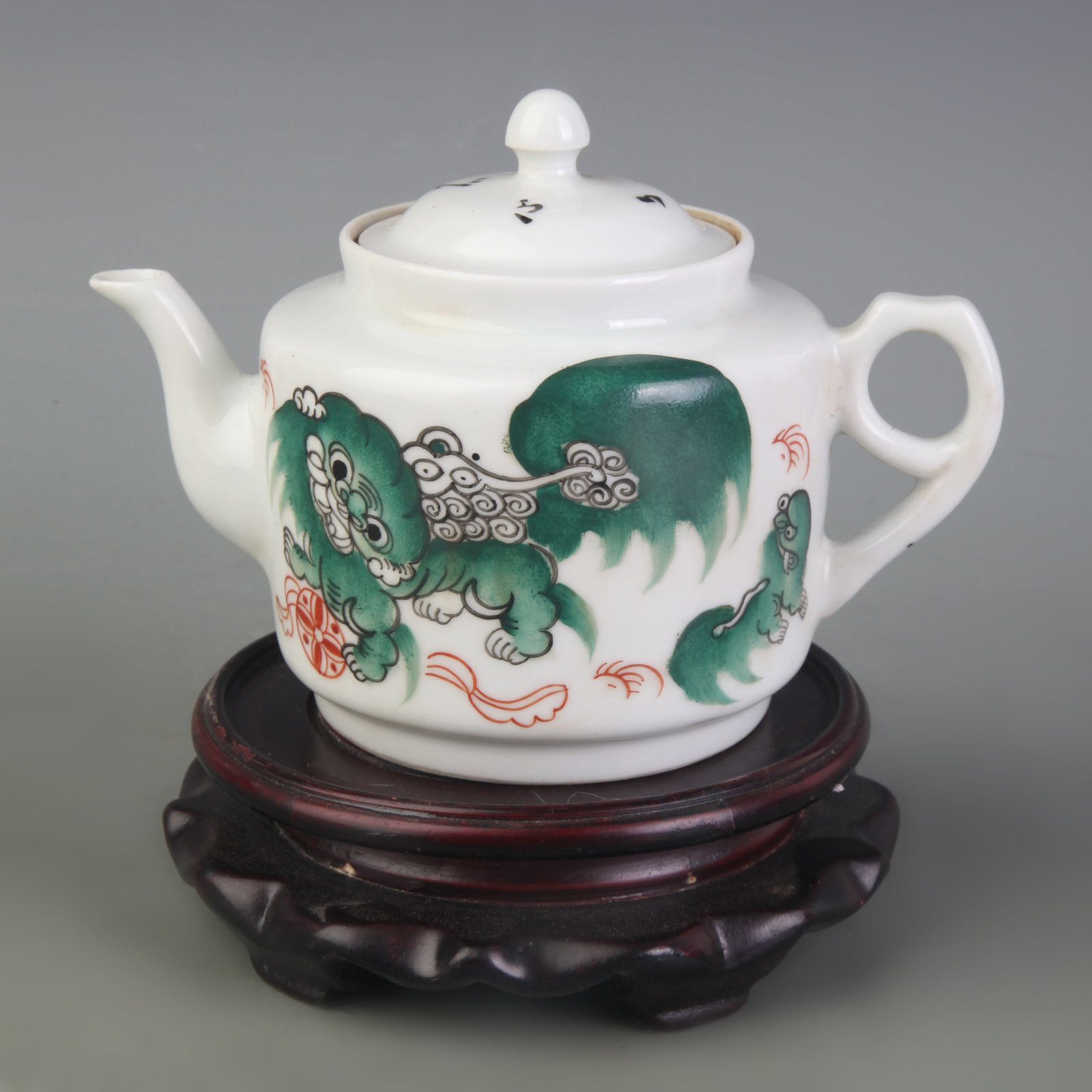 FAMILLE ROSE TEAPOT WITH GRAND TUTOR AND JUNIOR GUARDIAN MOTIF: Qing Dynasty Tong Zhi Period; Width: 6.4 inch; High:4.3 inch; wooden base for picture and display purpose only.