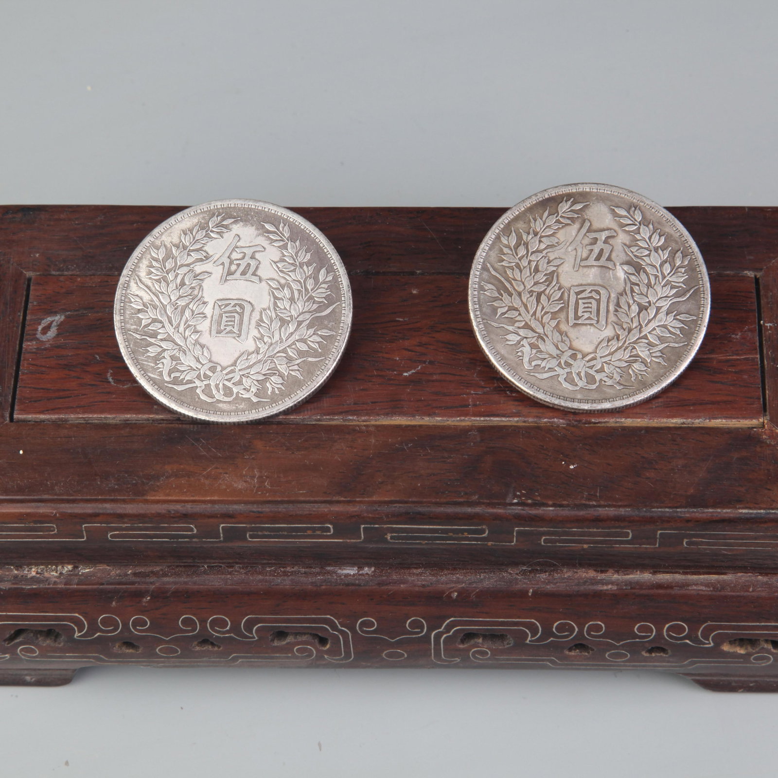 GROUP OF TWO OLD CHINESE "YUAN SHIKAI" COINS: Republic Period, Diameter: 1.8 inch; wooden base for picture and display purpose only.