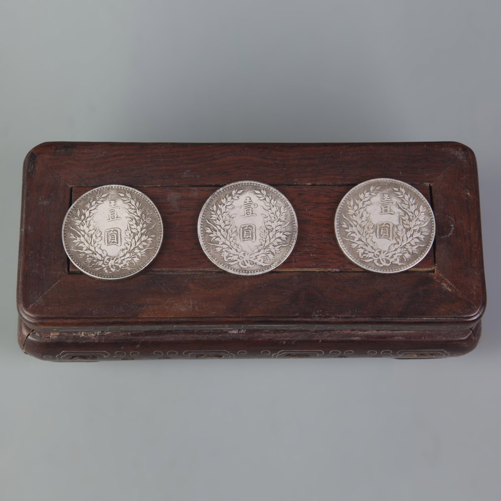 GROUP OF THREE OLD CHINESE COINS: Republic Period, Diameter:1.6 inch; wooden base for picture and display purpose only.
