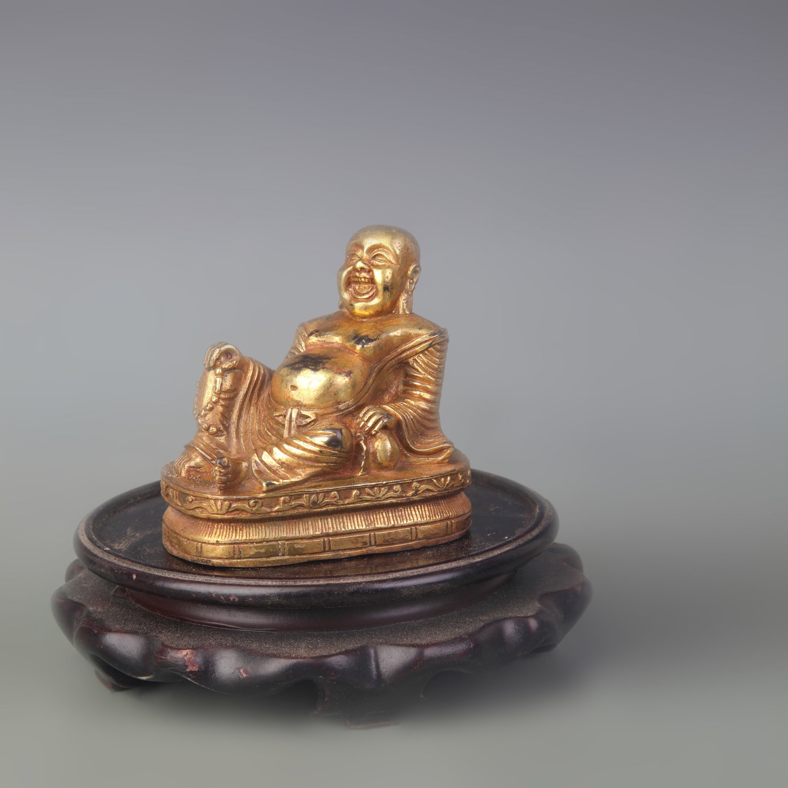 A FINE GILT BRONZE MAITREYA BUDDHA STATUE: Qing Dynasty; Width: 3.1 inch; High: 3.0 inch; wooden base for picture and display purpose only.