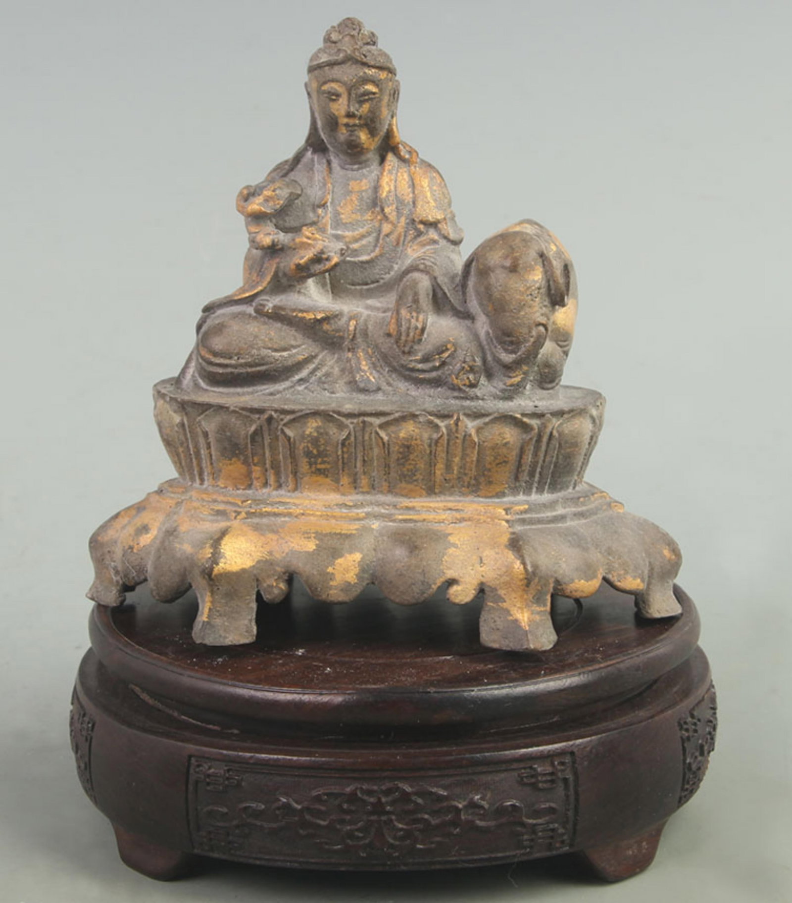 A FINE GILT BRONZE MANJUSHRI BODHISATTVA STATUE: 20th Century; High: 4.80 inch Width: 2.80 inch Long: 5.00 inch ; wooden base for picture and display purpose only.