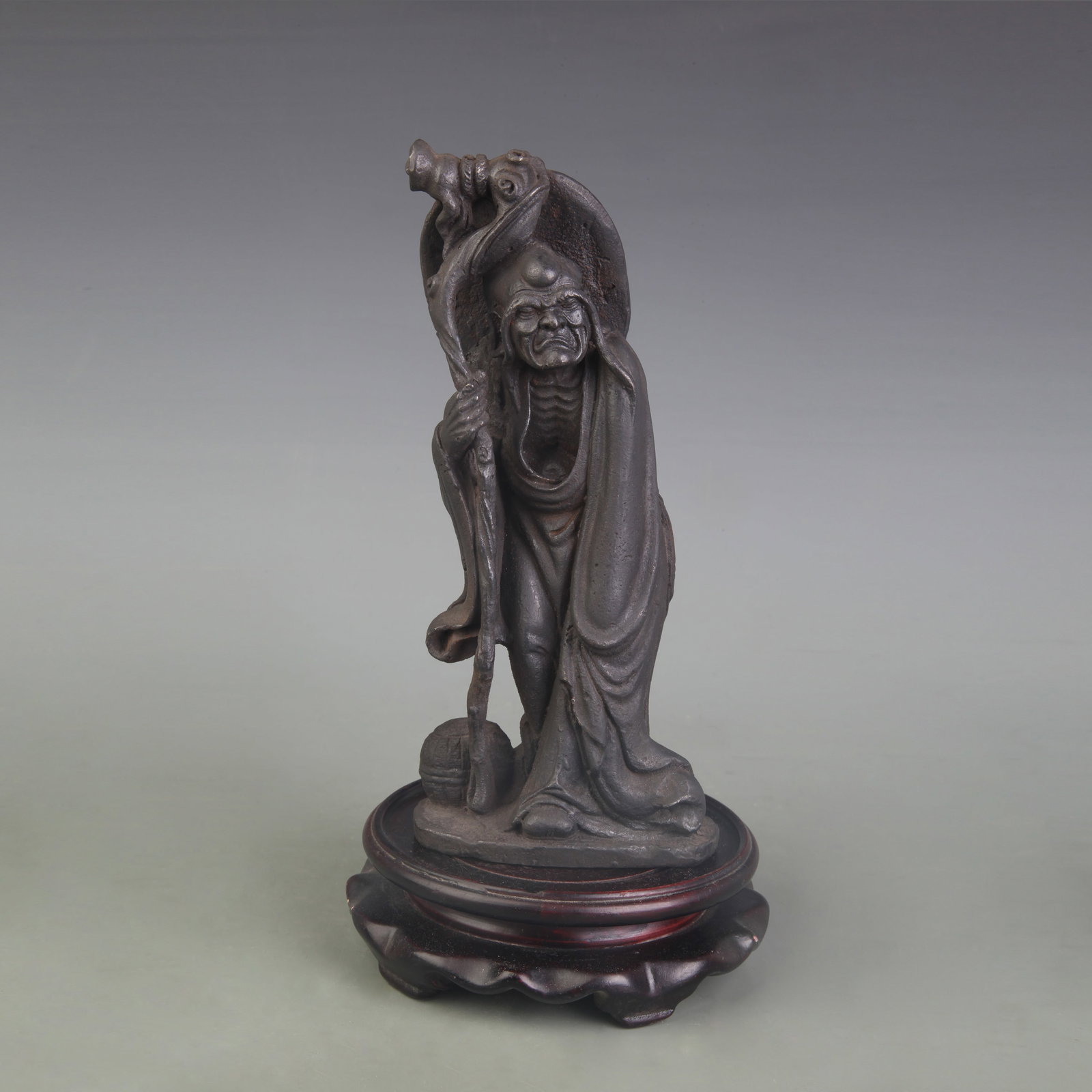 A FINE CAST IRON ARHAT STATUE: Qing Dynasty; Width: 3.6 inch; High:8.6 inch; wooden base for picture and display purpose only.