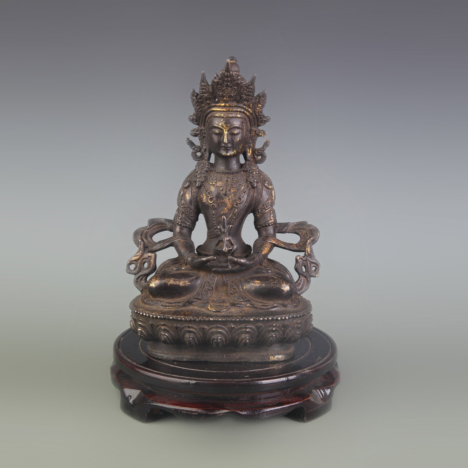 A TIBETAN BRONZE FIGURE OF GREEN TARA: Qing Dynasty; High: 8.5 inch; wooden base for picture and display purpose only.