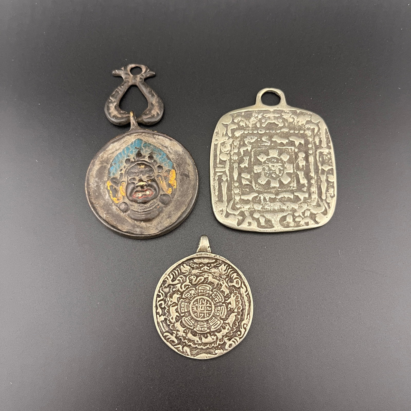 GROUP OF THREE TIBETAN NINE PALACE BAGUA SIPAHO PENDANT: Qing Dynasty; Long: 2.52 inch; Width: 2.1 inch; High: 0.11 inch; Long: 3.1 inch; Width: 1.82 inch; High: 0.35 inch; Long: 1.84 inch; Width: 1.5 inch; High: 0.12 inch;