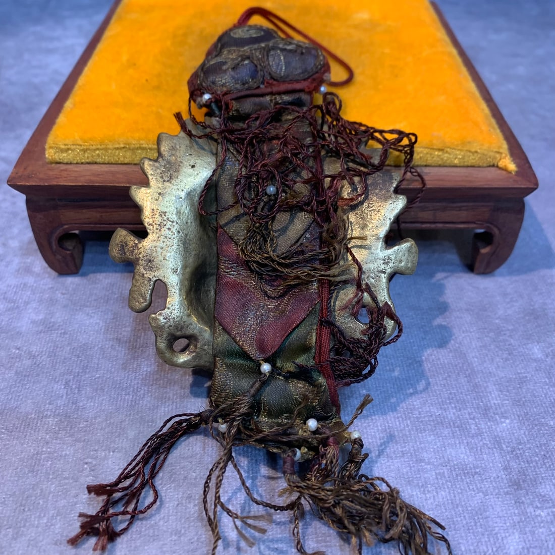 A FINE TIBETAN BUDDHIST INSTRUMENTS PENDANT: Modern; High: 3.4 inch; Width: 3.3 inch; wooden base for picture and display purpose only.