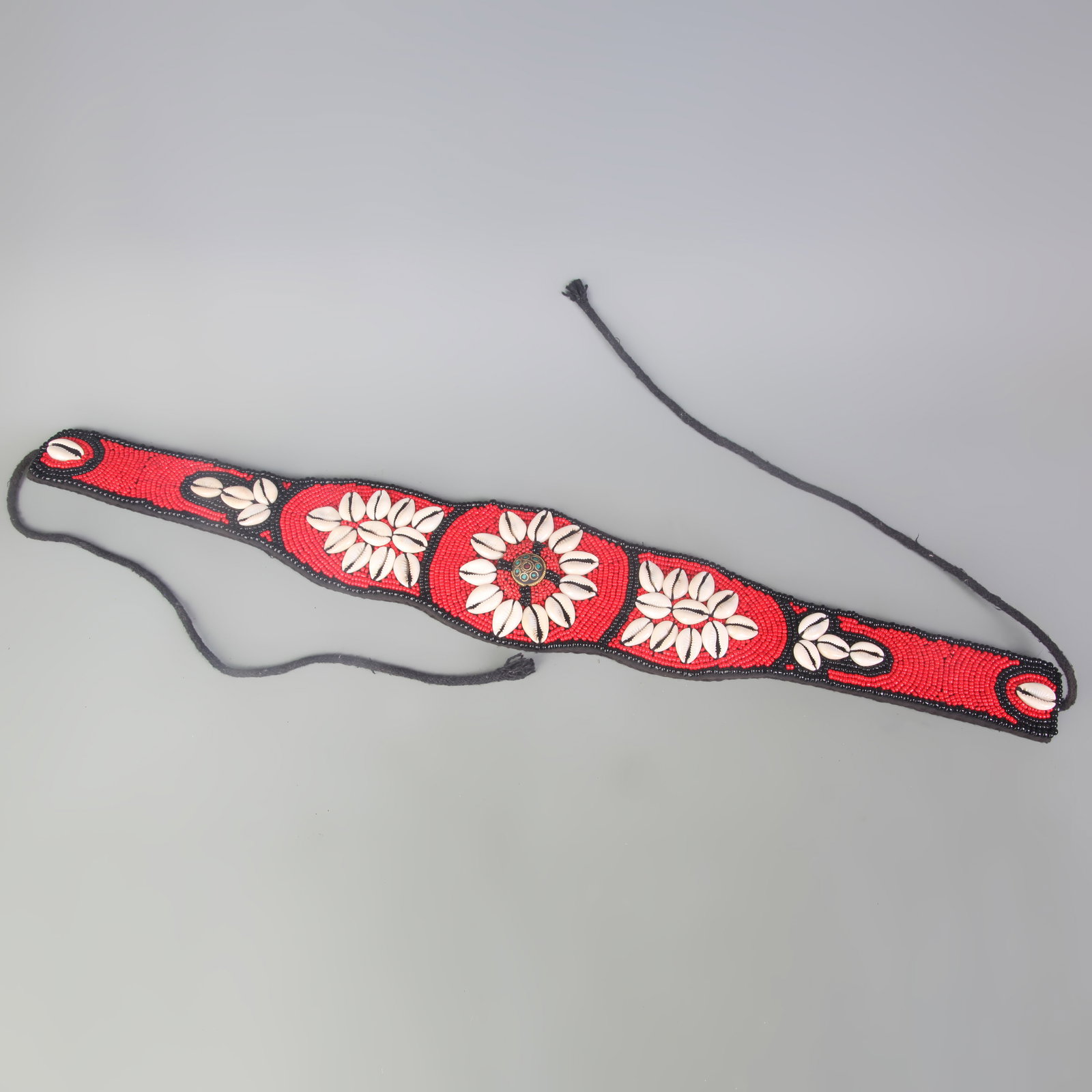 A GROUP OF TIBETAN BUDDHIST ORNAMENTS (RED CORAL AND SHELL): Modern; Long: 24.4 inch