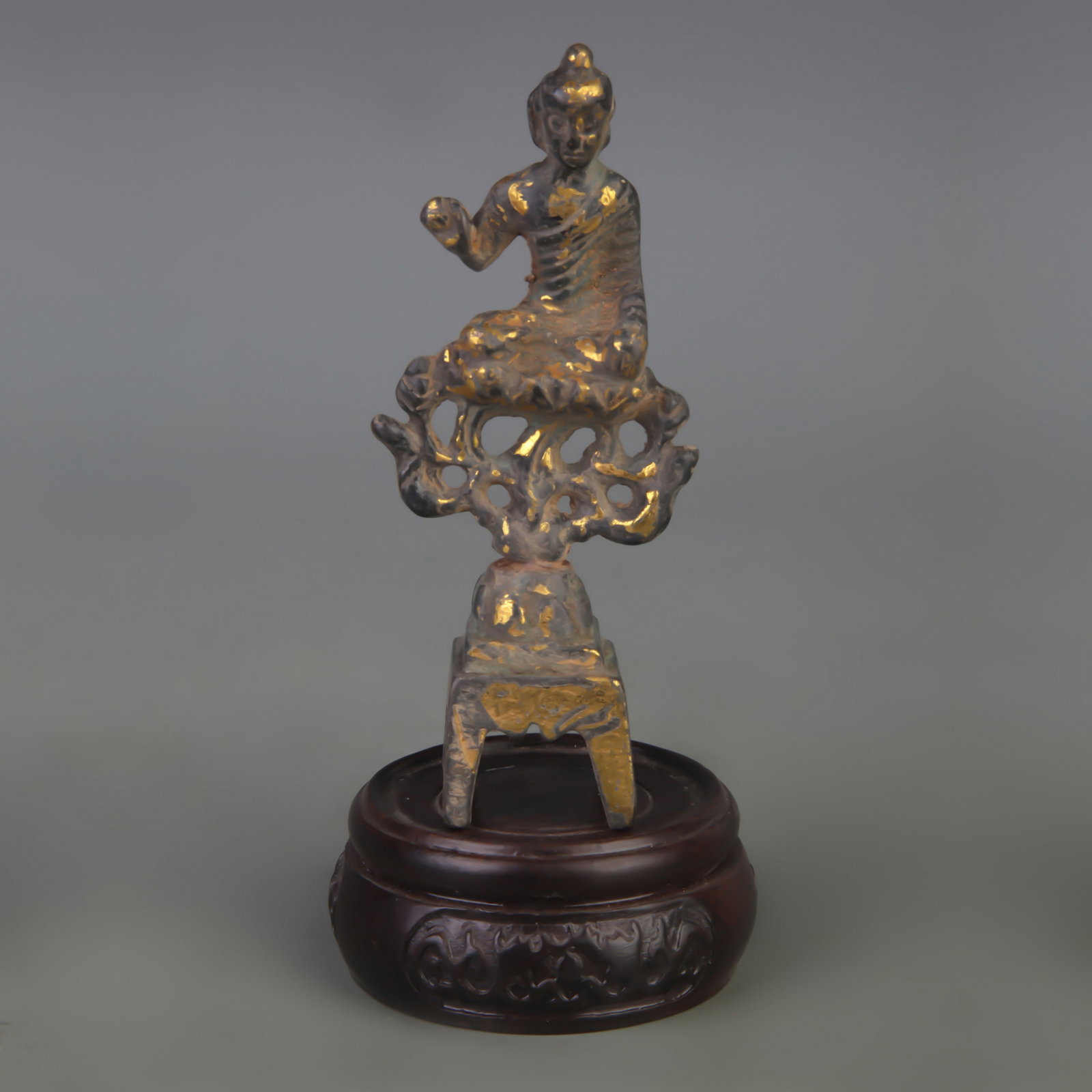 A SMALL BRONZE TIBETAN BUDDHIST STATUE: Qing Dynasty; Width: 1.8 inch; High: 4.2 inch; wooden base for picture and display purpose only.