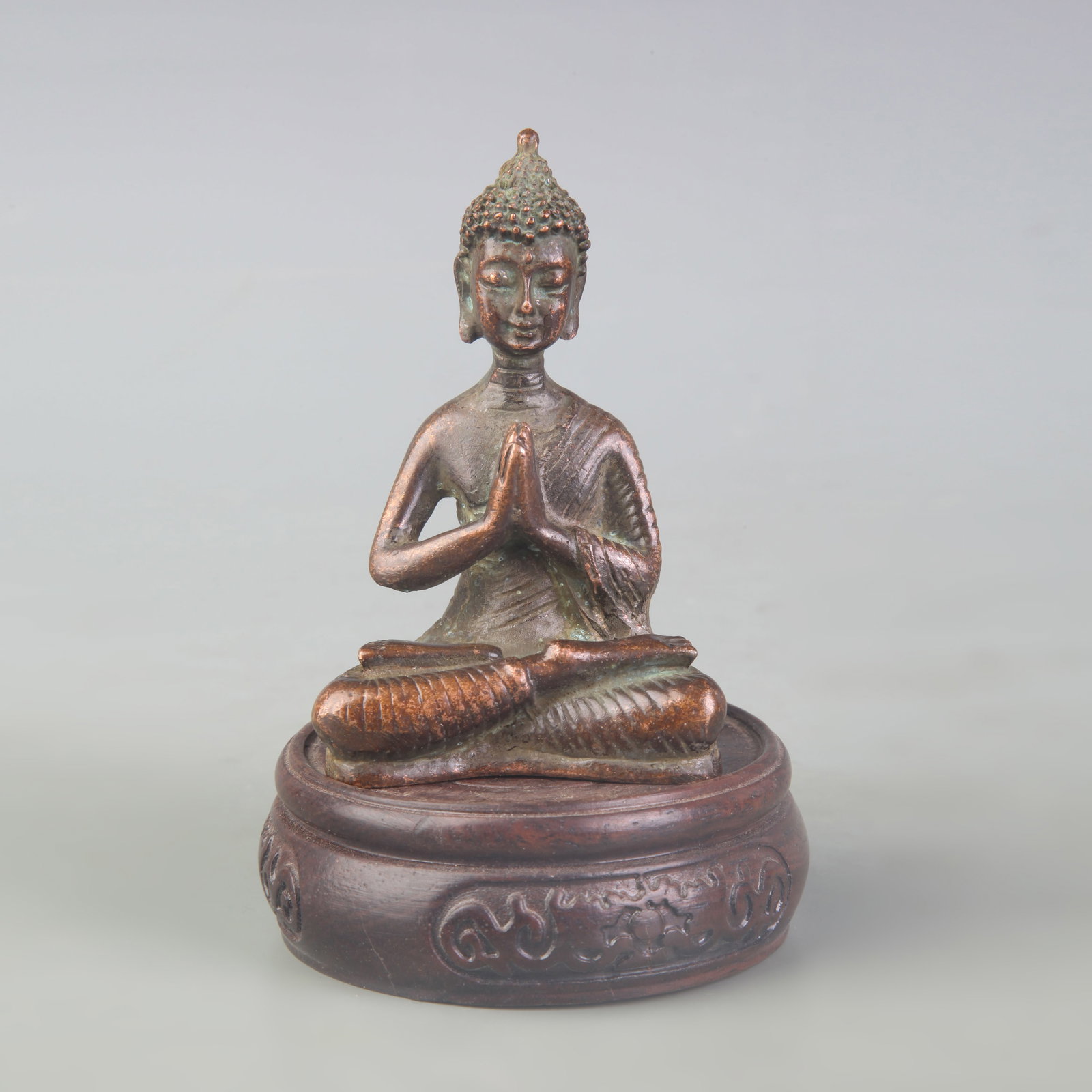 A FINE SMALL BRONZE BUDDHA STATUE: Qing Dynasty; High: 3.3 inch; wooden base for picture and display purpose only.