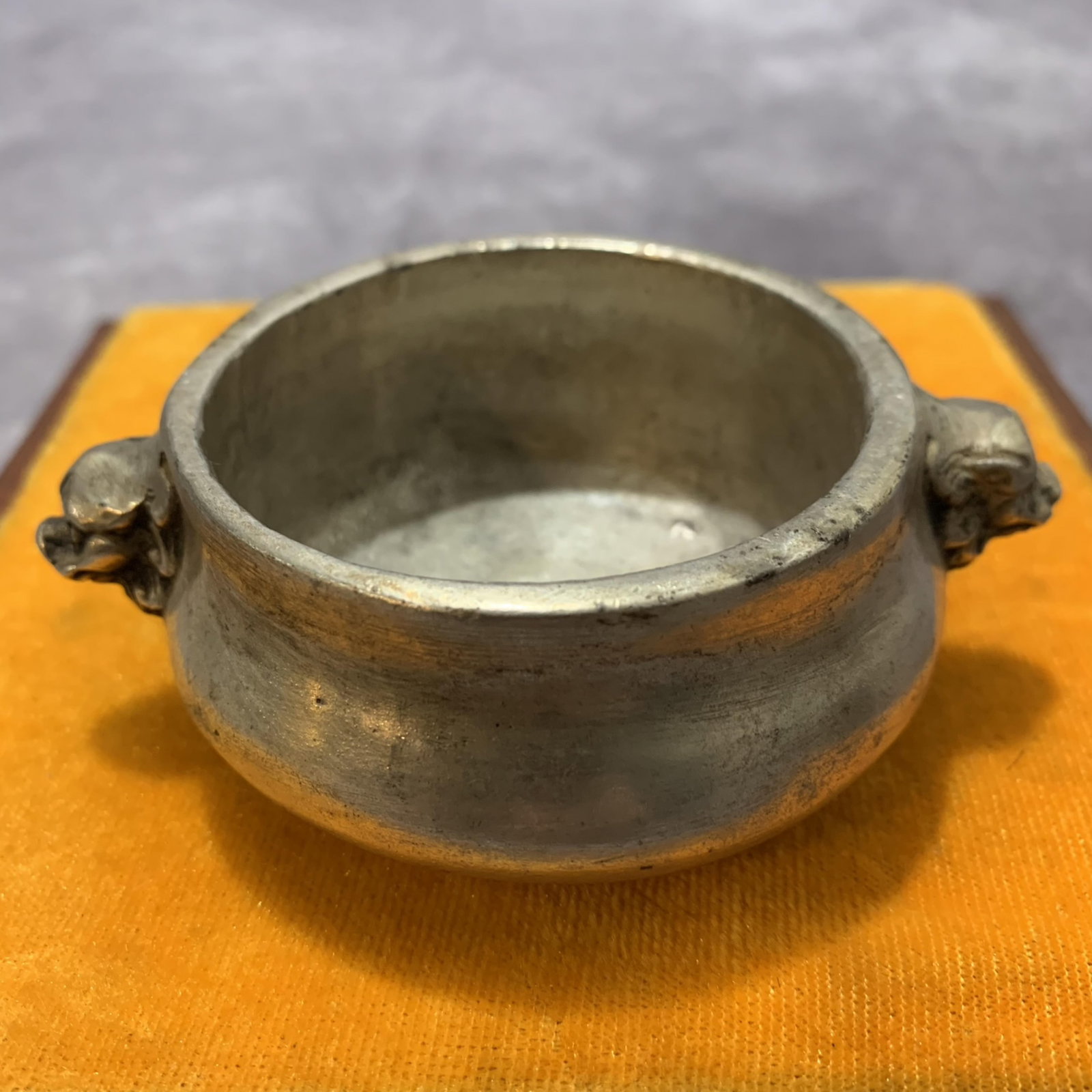 A FINE WHITE BRONZE CENSER WITH ANIMAL-HEAD HANDLES: Qing Dynasty; Width: 2.9 inch; High: 1.3 inch; wooden base for picture and display purpose only.
