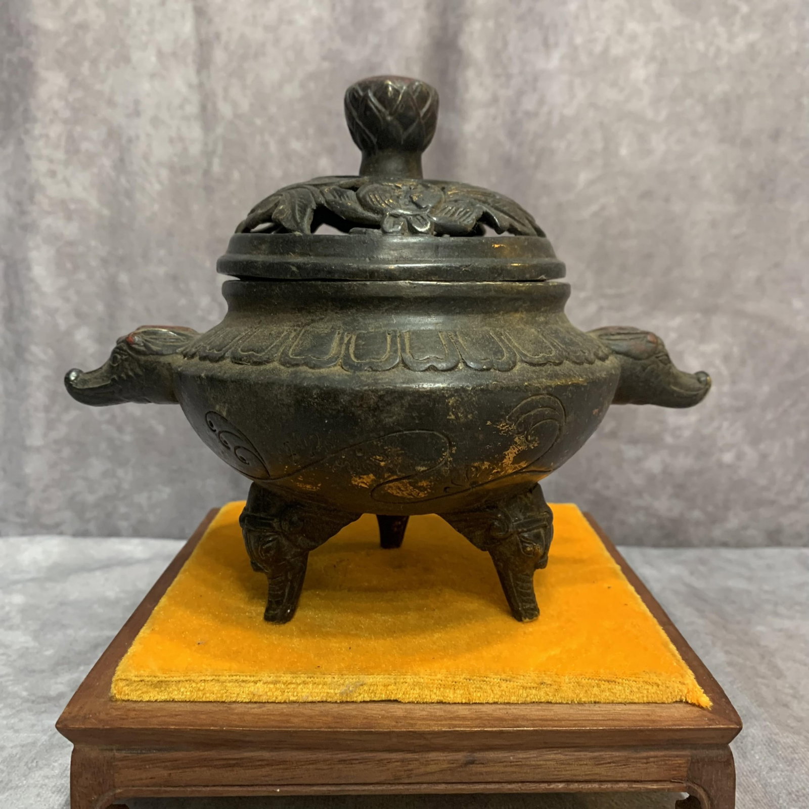 BRONZE QIANLONG MARK BEAST HEAD THREE FOOT INCENSE BURNER: Qing Dynasty Qian Long Period; High: 6.0 inch; Width: 7.4 inch; Long: 4.9 inch; wooden base for picture and display purpose only.