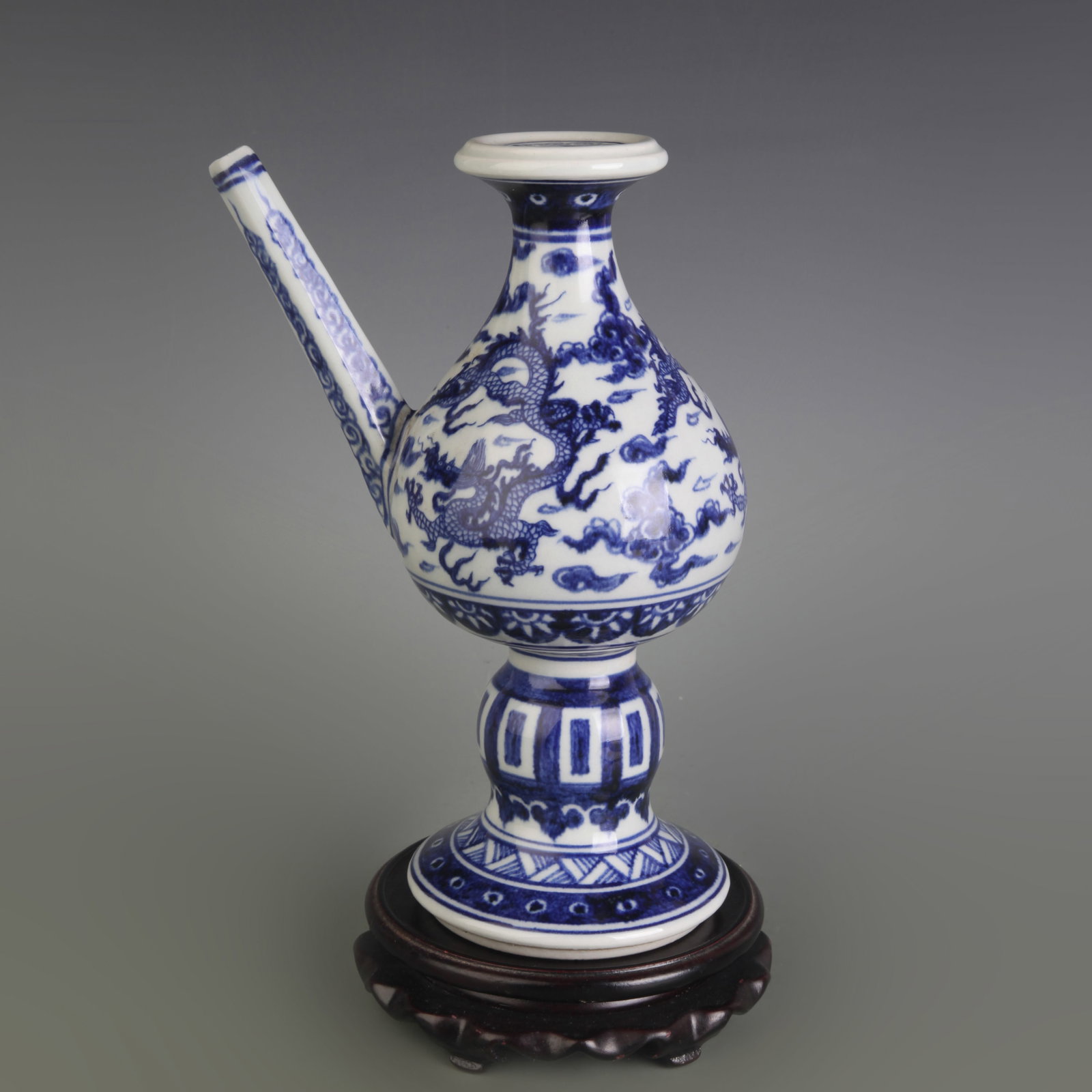 BLUE AND WHITE DRAGON PATTERN PORCELAIN TEAPOT: Ming Dynasty Style Xuan De Period; Width: 6.1 inch; High: 9.2 inch ; wooden base for picture and display purpose only.
