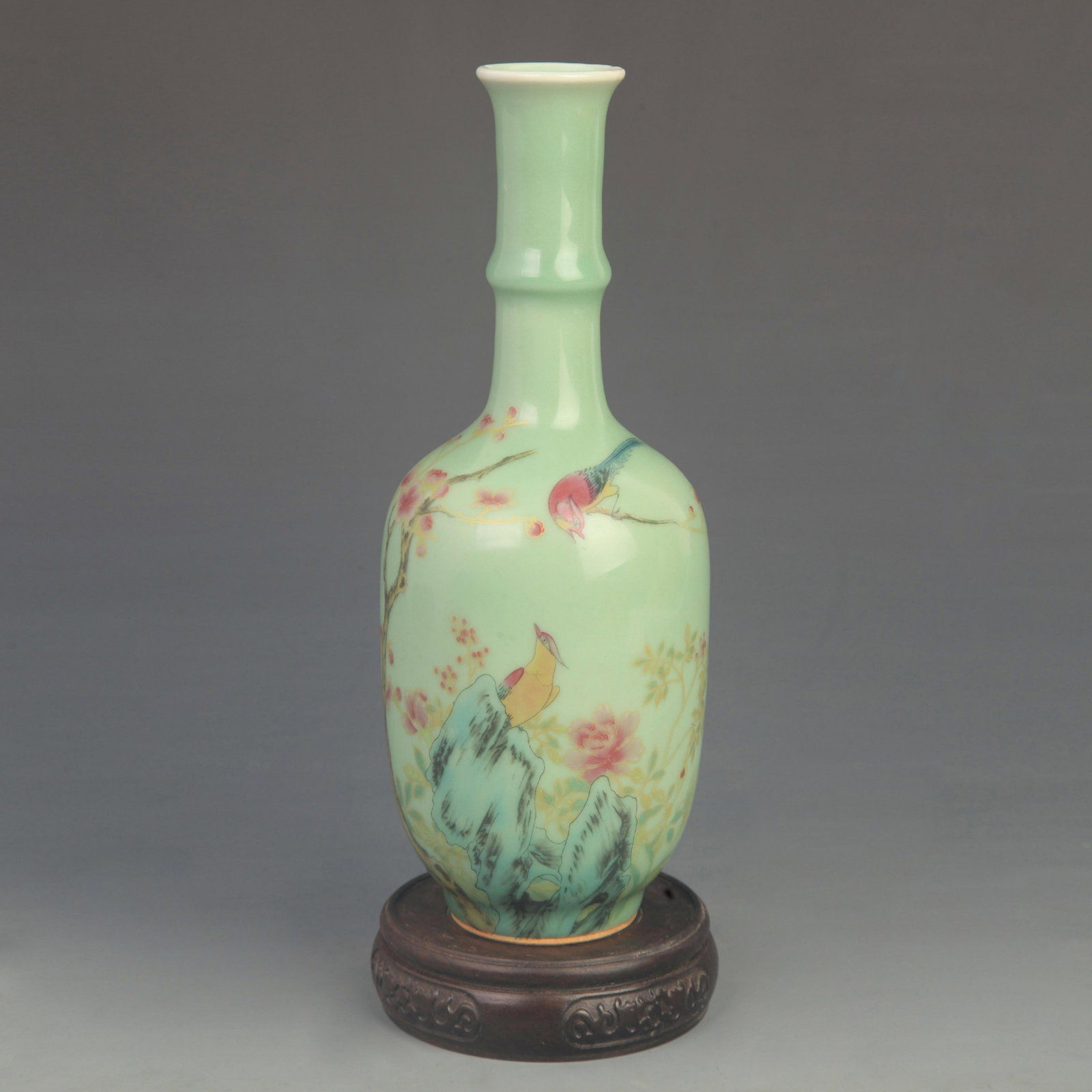 FAMILLE ROSE LONG NECK CELADON VASE WITH PHOENIX PATTERN: Qing Dynasty Qian Long Period; High: 9.50 inch; Diameter: 3.50 inch; wooden base for picture and display purpose only.