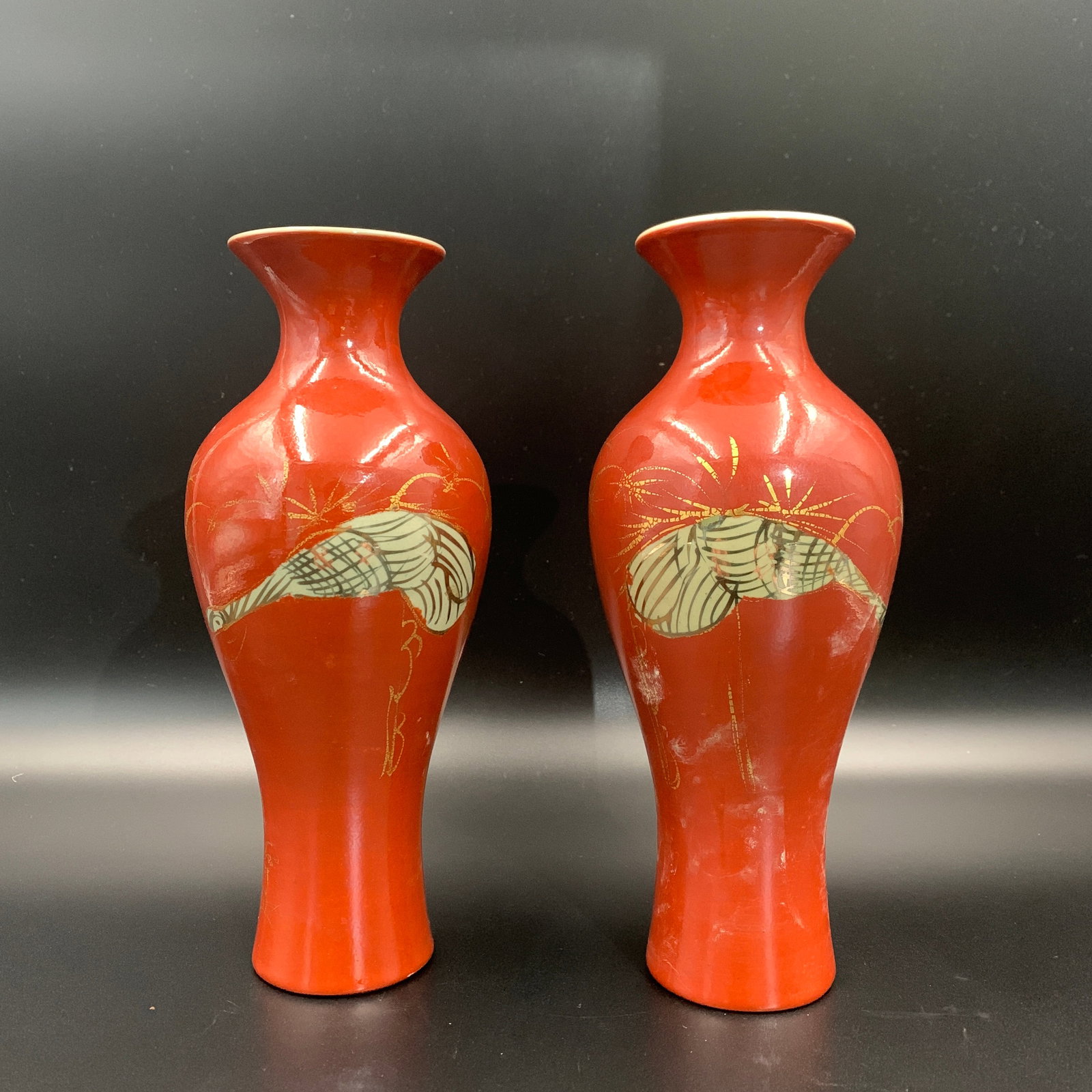 A PAIR OF CHINESE GILT-DECORATED IRON-RED GLAZED SPITTOON-SHAPED VASES (ZHA DOU / HU): Republic Period; High: 9.1 inch; Diameter: 3.7 inch; wooden base for picture and display purpose only.