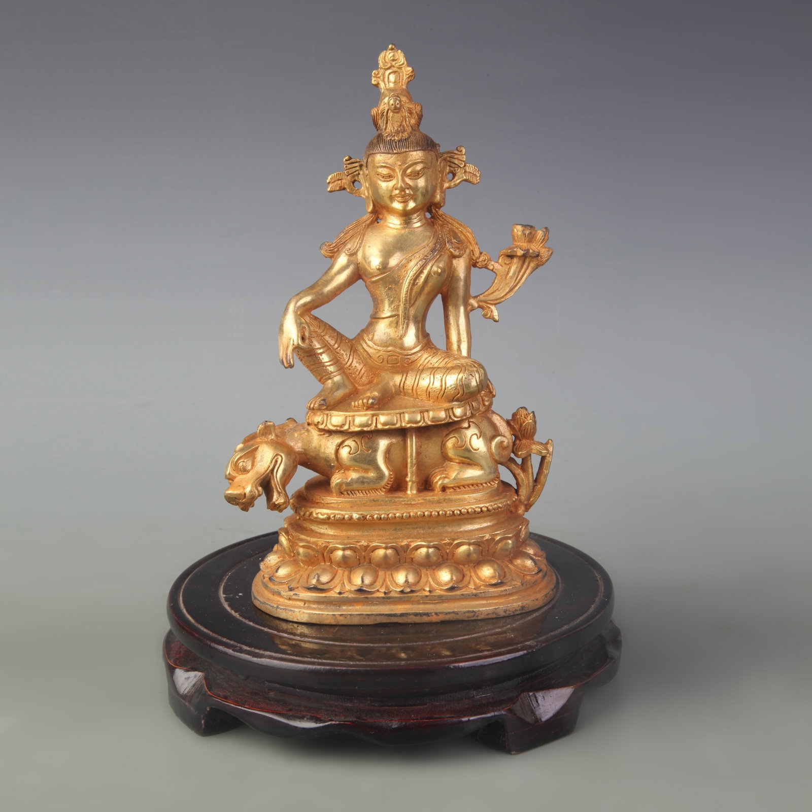 A FINE BRONZE FIGURE OF ???EISURELY??GUANYIN: Qing Dynasty; High: 8.0 inch; wooden base for picture and display purpose only.