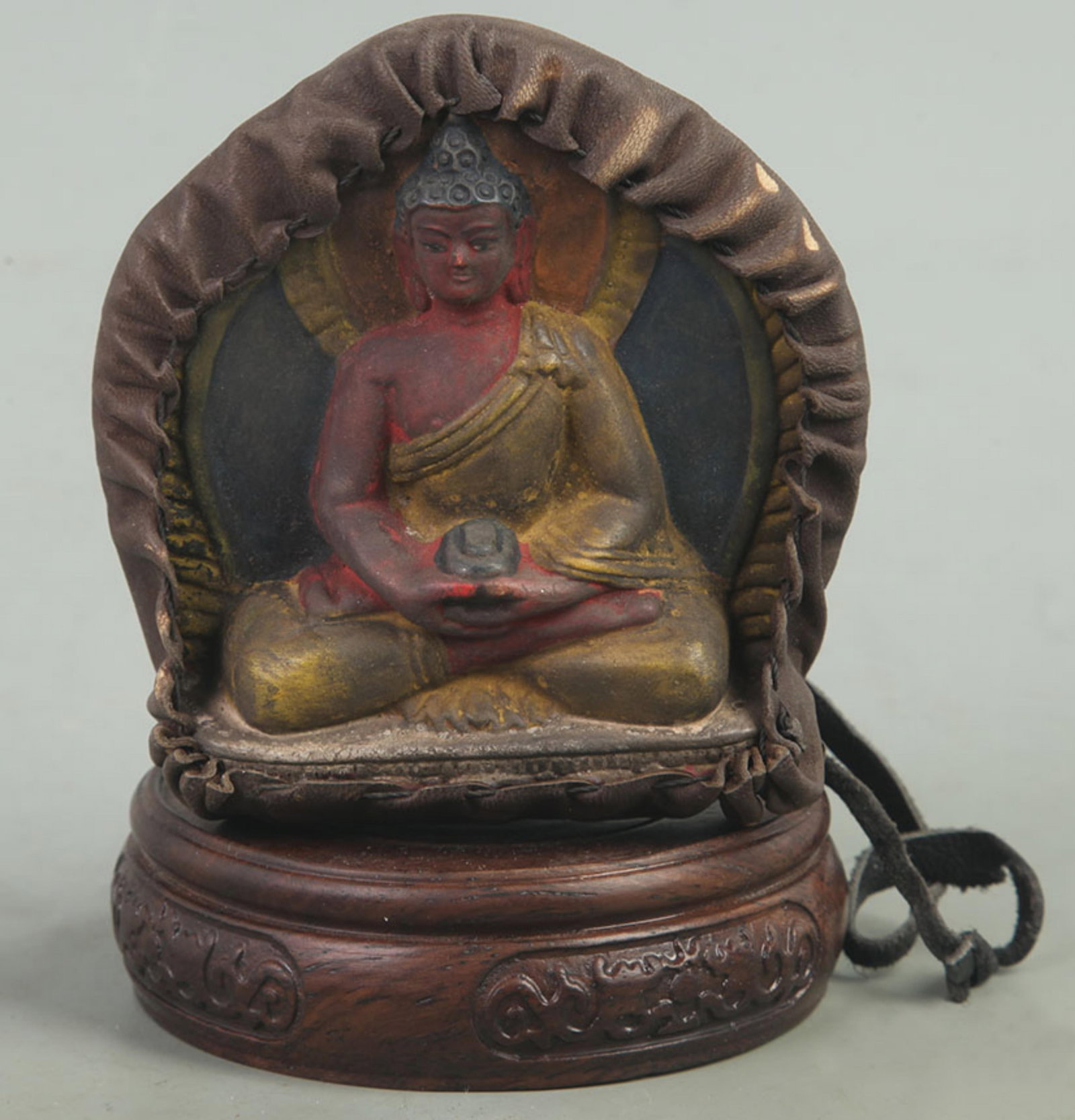 A SMALL BRONZE TIBETAN BUDDHISM PENDANT: Qing Dynasty, High: 4.00 inch; Width: 3.90 inch; wooden base for picture and display purpose only.