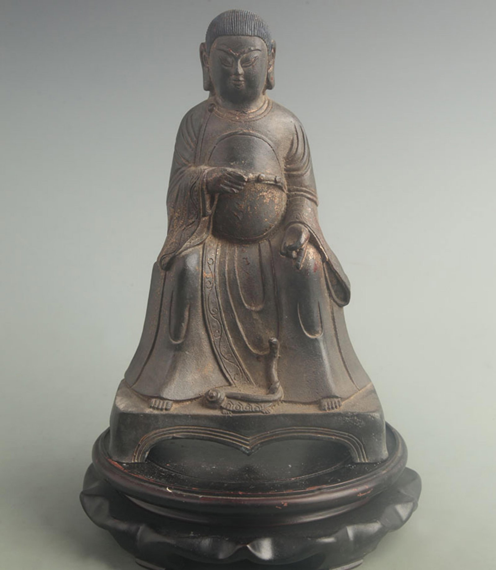 A FINE GILT-BRONZE ZHEN WU DEITY STATUE: 19th Century; High:9.20 inch; Width: 3.50 inch; Long: 6.20 inch; wooden base for picture and display purpose only.