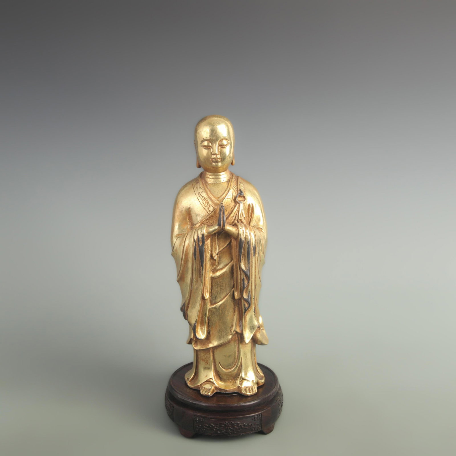 A TIBETAN BUDDHIST FIGURE OF ANANDA: 19th Century; High: 12.0 inch; Width: 3.20 inch; Long: 3.60 inch; wooden base for picture and display purpose only.