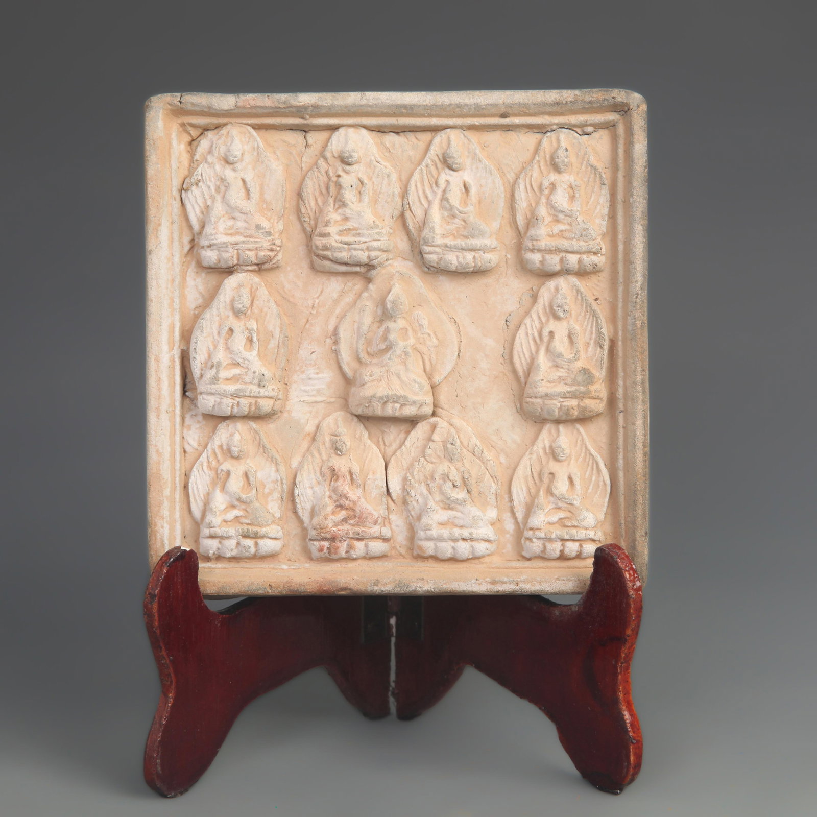 A FINE CERAMIC BRICK CARVING OF ELEVEN BUDDHAS: Tang Dynasty Style; High: 4.50 inch; Width: 4.50 inch;; wooden base for picture and display purpose only.