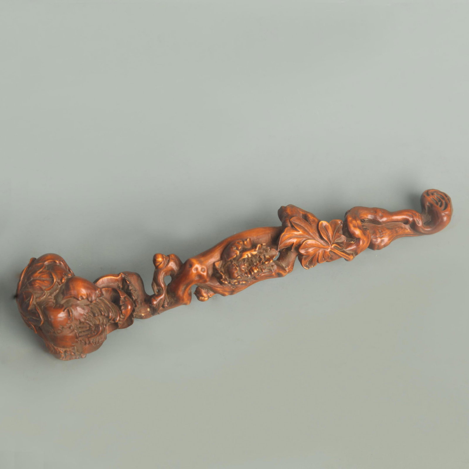 A FINELY CARVED BOXWOOD FIGURE OF RU YI: 20th Century, Long: 7.75 inch; Width: 1.50 inch;