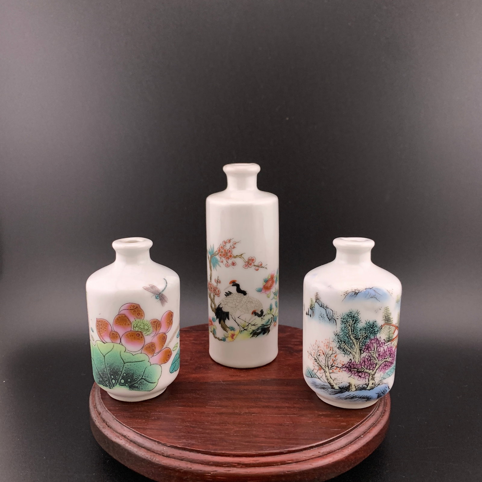 SET OF THREE FAMILLE ROSE PORCELAIN SNUFF BOTTLE: Modern; High: 2.6 inch; Diameter: 1.5 inch; High: 2.6 inch; Diameter: 1.5 inch; High: 2.74 inch; Diameter: 1.38 inch; wooden base for picture and display purpose only.
