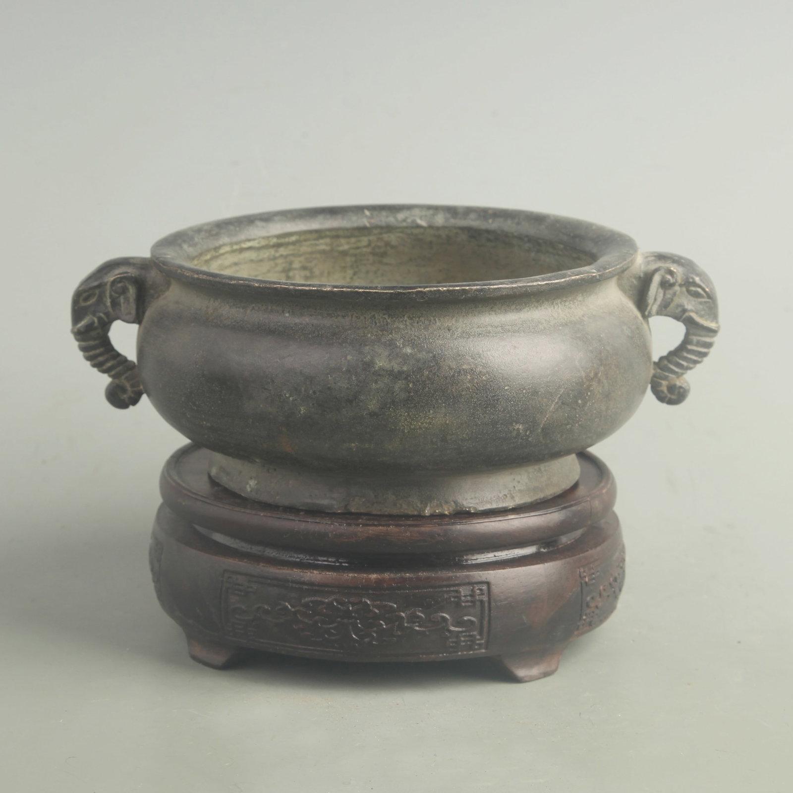 A FINE BRONZE ELEPHANT-EAR CENSER: Ming Dynasty Xuan De Period; High: 2.80 inch; Long: 7.50 inch; wooden base for picture and display purpose only.
