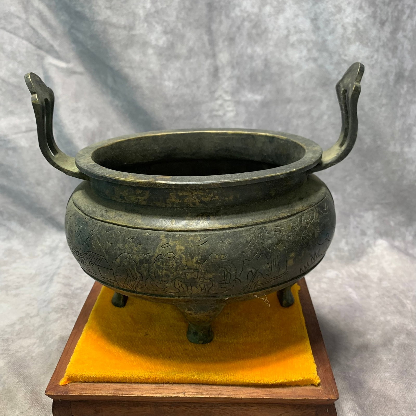 A KANG XI MARKED BRONZE CENSER WITH FIGURAL ENGRAVING: Qing Dynasty; Long: 7.4 inch; H; 6.3 inch. Wooden base for picture and display only.; wooden base for picture and display purpose only.
