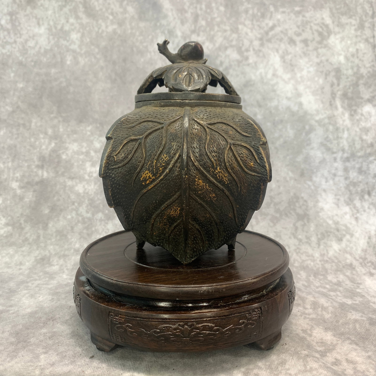 A CHINESE PARCEL-GILT BRONZE 'LOTUS LEAF AND SNAIL' TRIPOD INCENSE BURNER: Width:6.1 inch; Diameter: 5.8 inch; wooden base for picture and display purpose only.