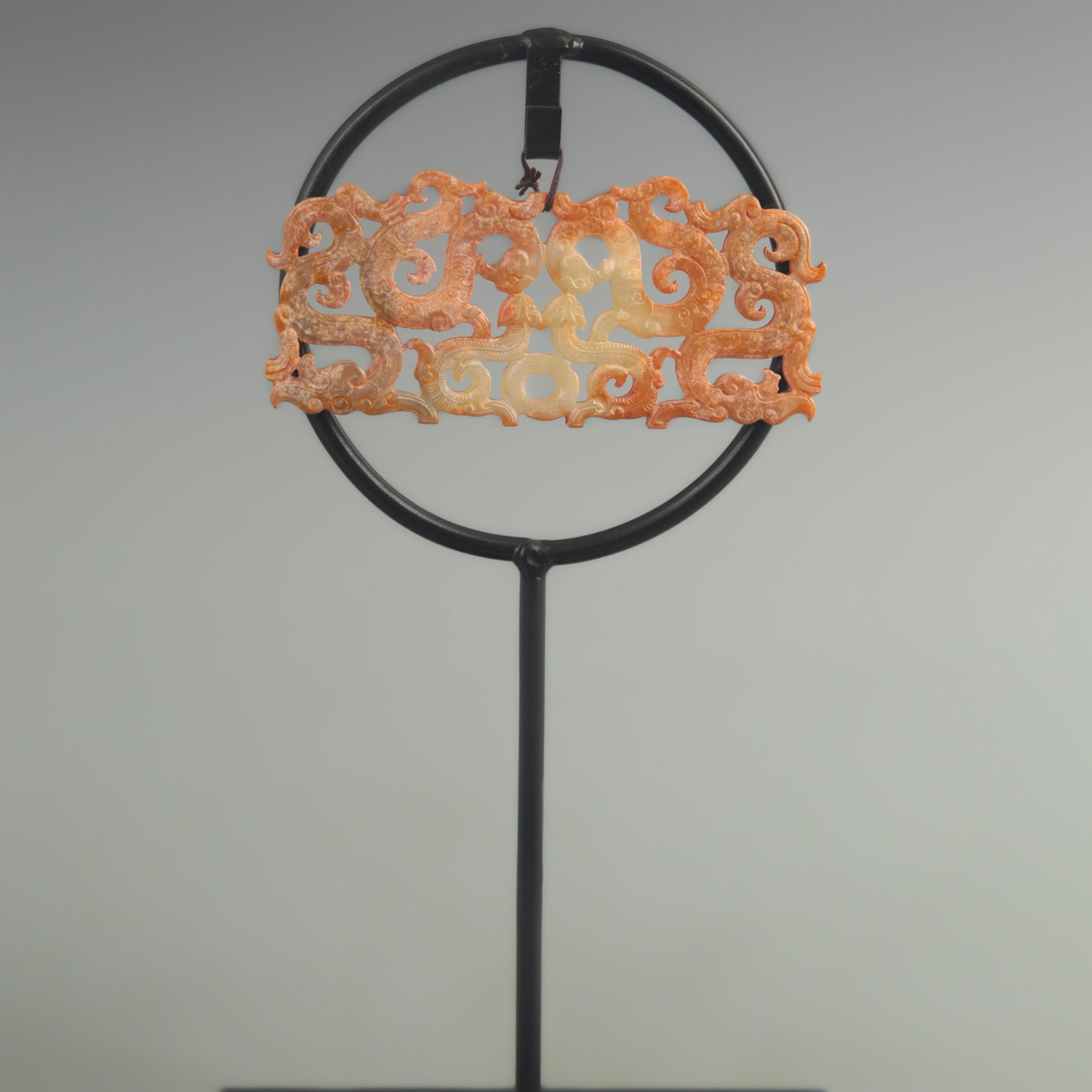 A FINE DRAGON MOTIF JADE PENDANT: Han Dynasty Style; High: 2.20 inch; Long: 5.5 inch; wooden base for picture and display purpose only.