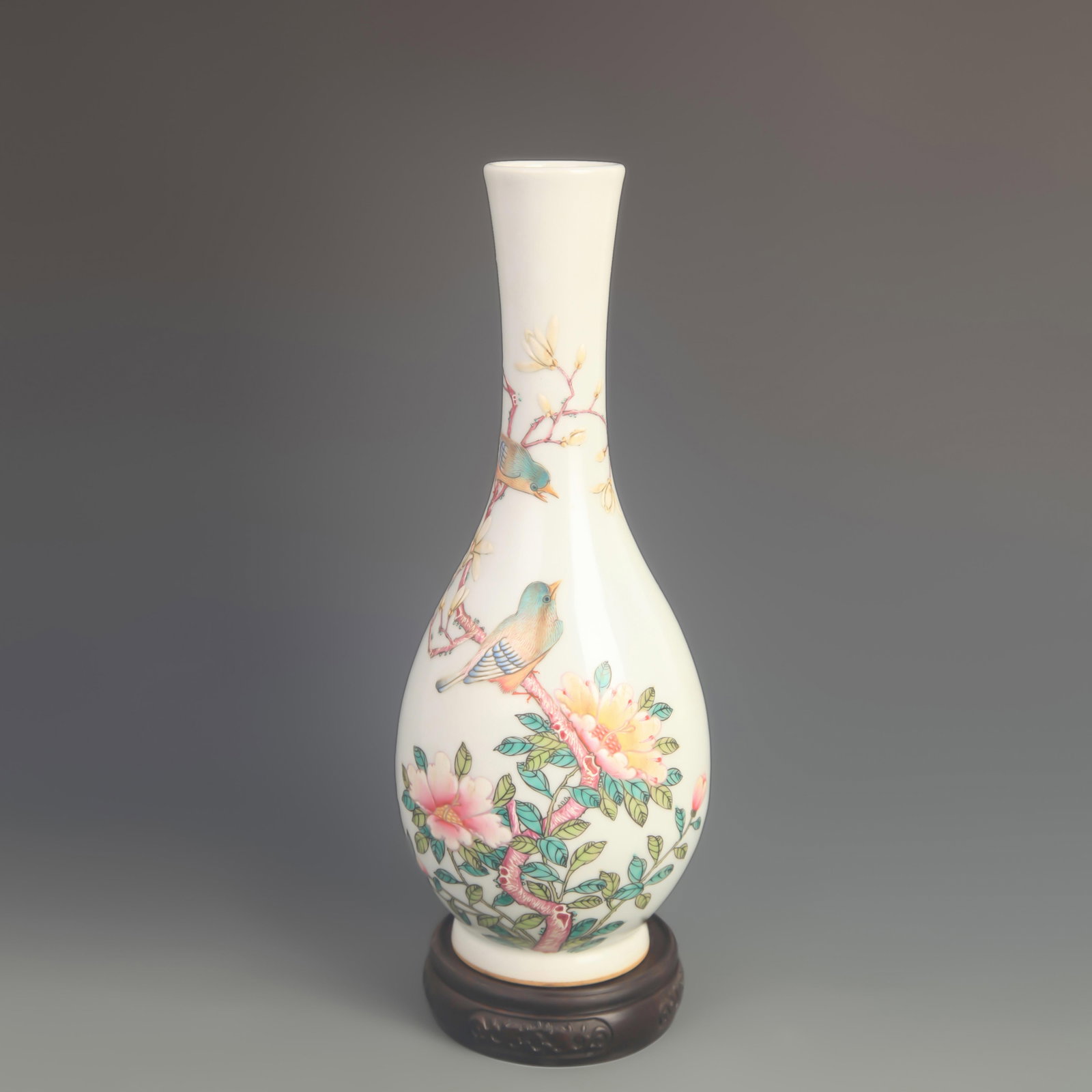 AN ENAMEL-PAINTED OLIVE-FORM VASE WITH FLORAL AND BIRD DECORATION: Qing Dynasty Qian Long Period; High: 11.2 inch; Diameter: 4.50 inch; wooden base for picture and display purpose only.