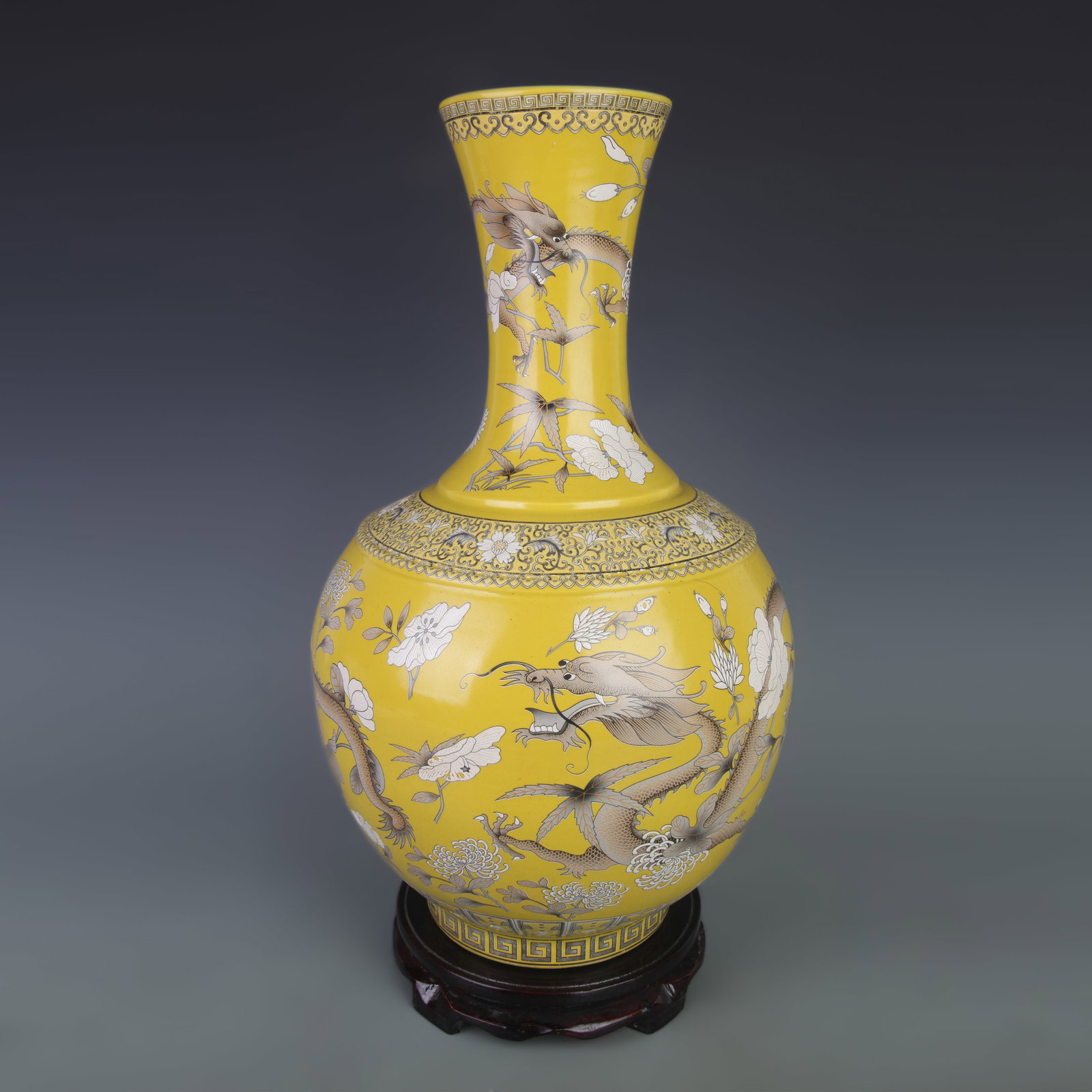 FAMILLE ROSE YELLOW GROUND FLORAL DRAGON GLOBE VASE: Qing Dynasty; Diameter: 10.3 inch; High: 16.6 inch; wooden base for picture and display purpose only.