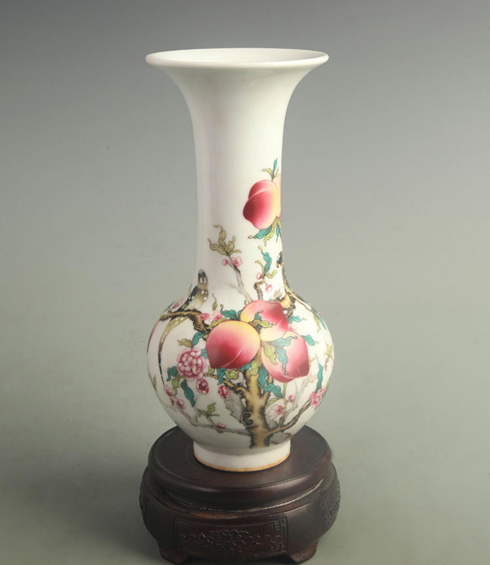 FAMILLE ROSE LONGEVITY PEACH FLOWER PATTERN PORCELAIN VASE: Qing Dynasty Qian Long Period; High: 9.20 inch; Diameter:4.00 inch; wooden base for picture and display purpose only.