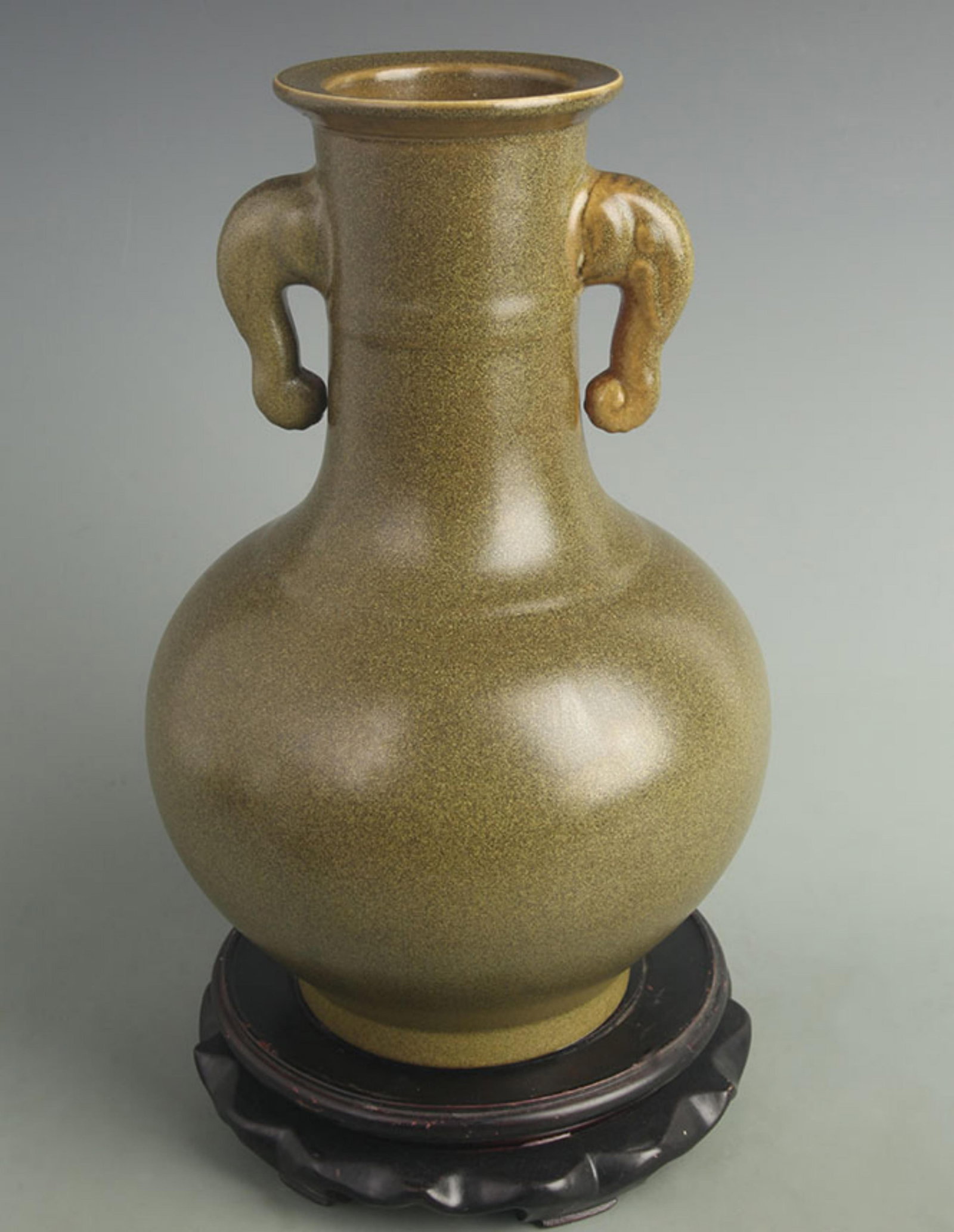 A FINE TEA-DUST GLAZED ELEPHANT-EAR ZUN VASE: Qing Dynasty Yong Zheng Period; High:12.0 inch; Width:7.50 inch; wooden base for picture and display purpose only.