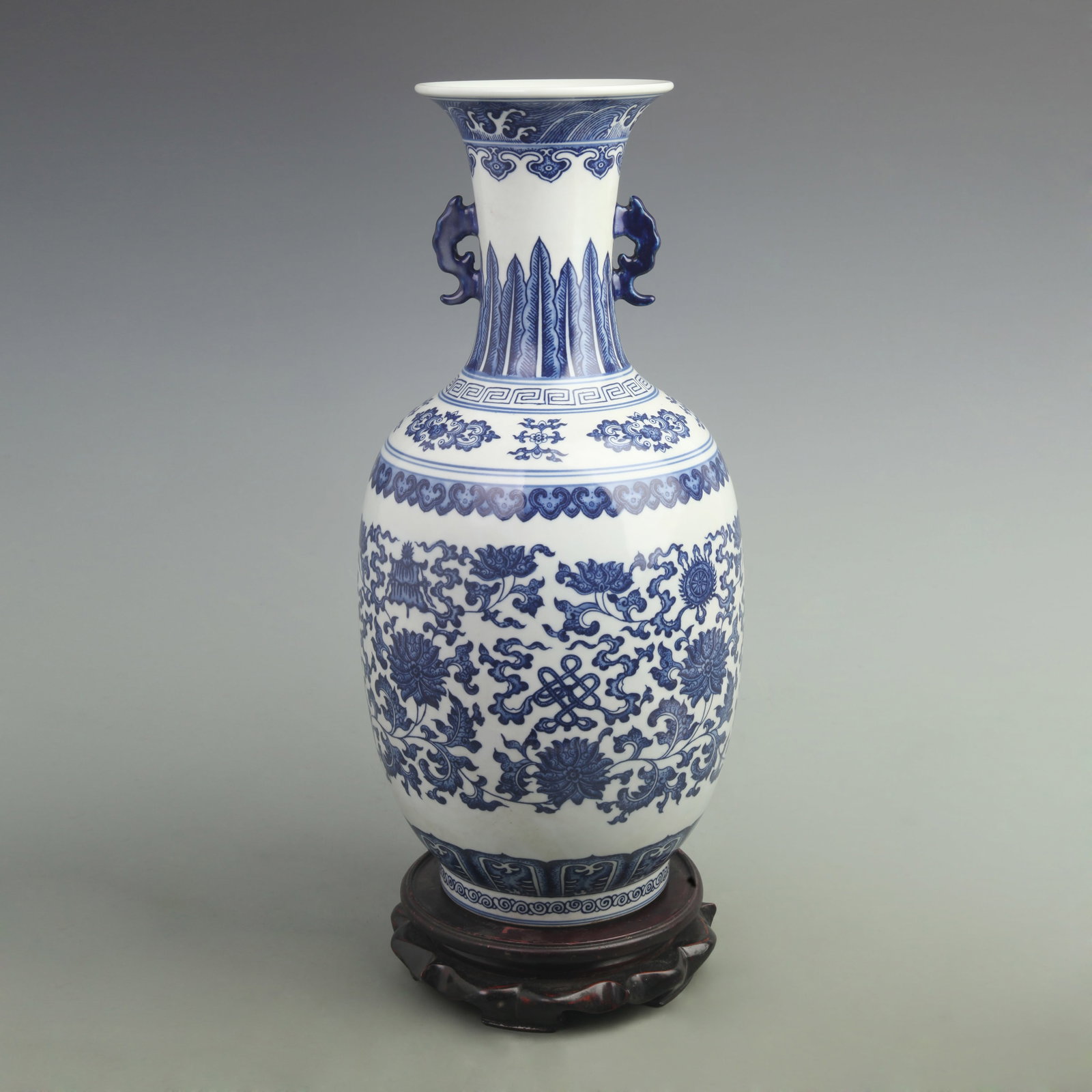RARE BLUE AND WHITE BRANCHES PATTERN DOUBLE-EARED PORCELAIN VASE: Qing Dynasty Qian Long Period; High: 17 inch; Width: 7.0 inch; wooden base for picture and display purpose only.