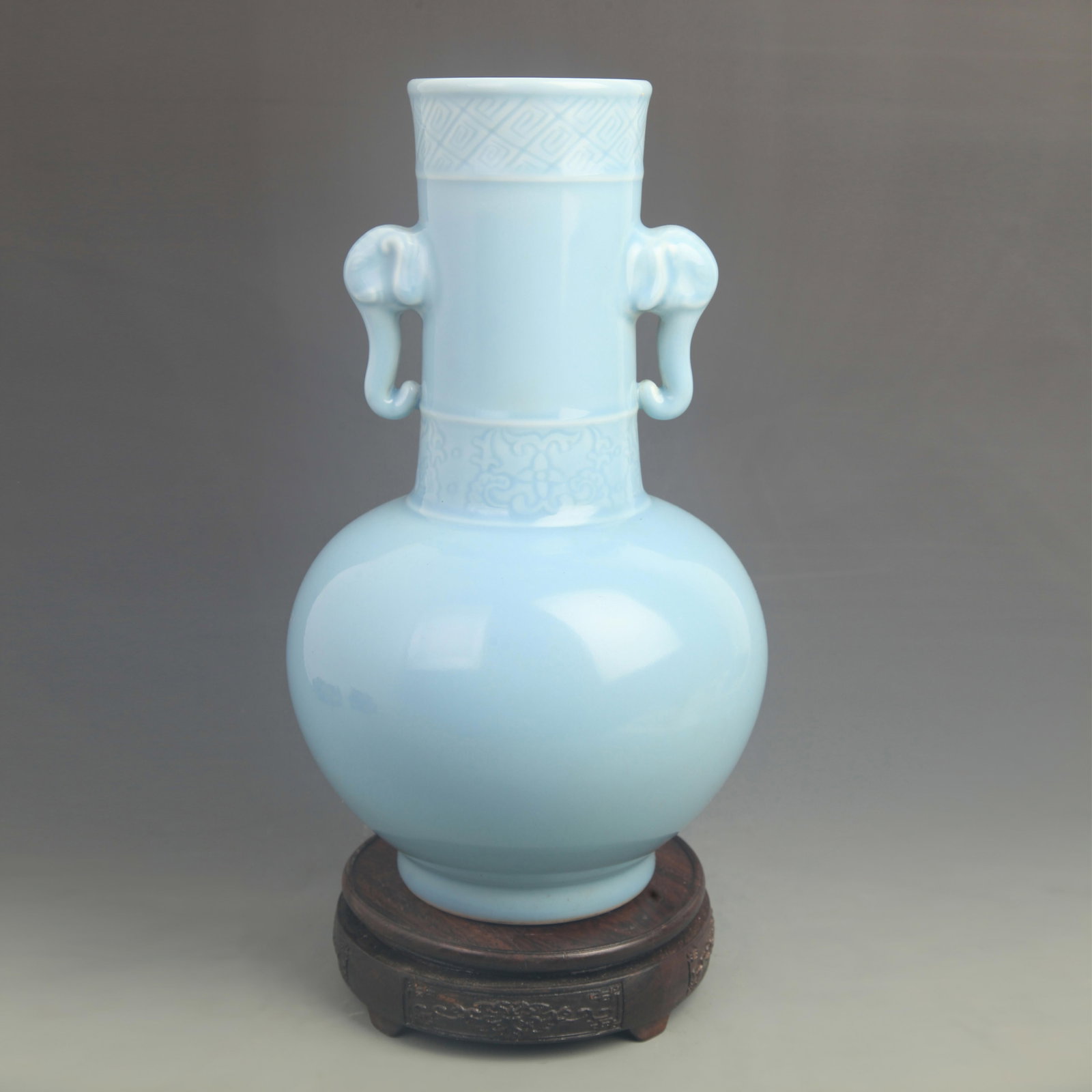 SKY BLUE-GLAZED ELEPHANT-EAR STRAIGHT-NECKED VASE: Qing Dynasty Qian Long Period; High: 13.3 inch; Diameter: 7.50 inch; wooden base for picture and display purpose only.