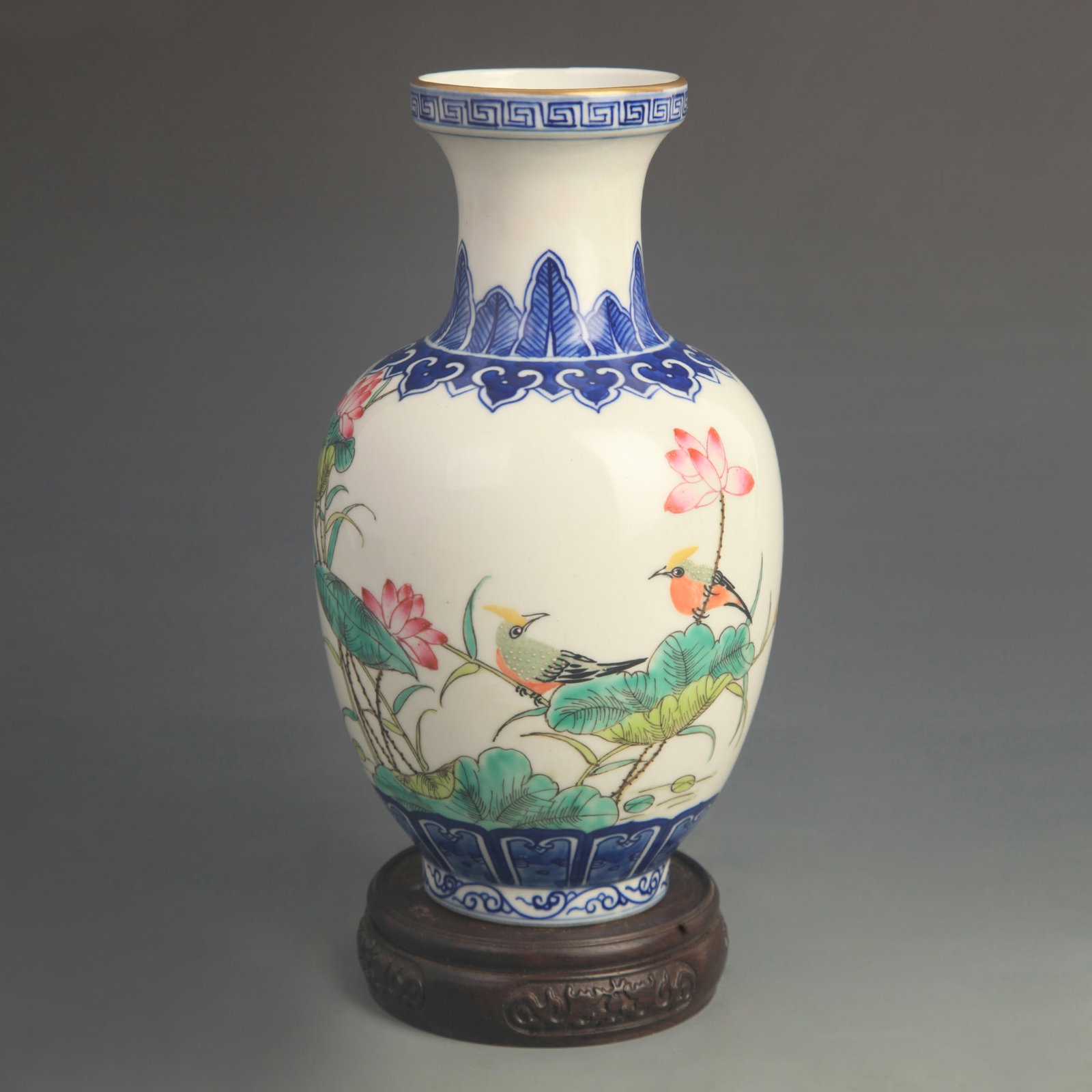 A FINE CLOISONNE GLAZED FLOWER AND BIRD PATTERN PORCELAIN VASE: Qing Dynasty Qian Long Period; High: 8.50 inch; Diameter: 4.50 inch; wooden base for picture and display purpose only.