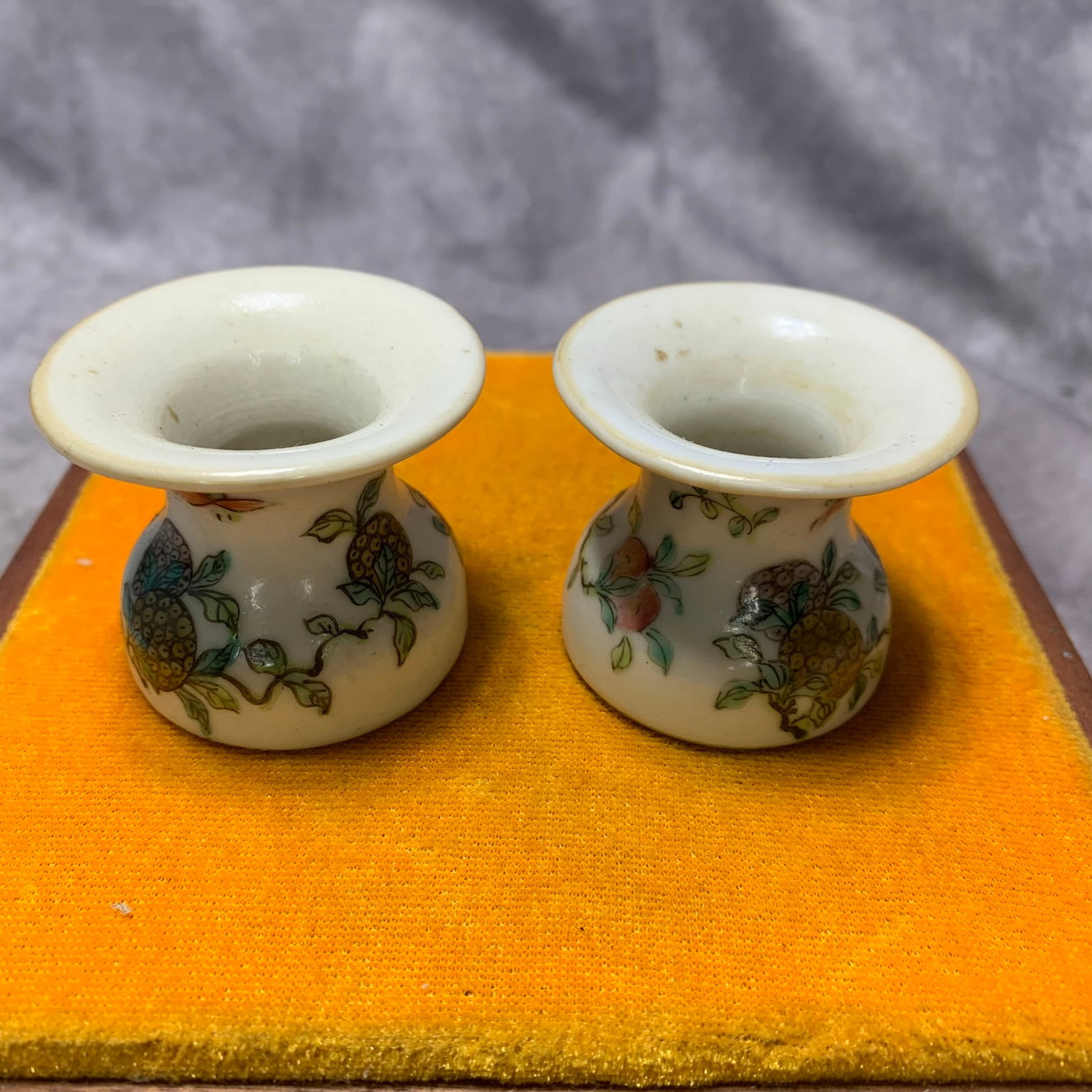 PAIR OF FAMILLE ROSE FLORAL PATTERN PORCELAIN WINE CUPS: Qing Dynasty; High: 1.7 inch; Diameter: 2 inch; wooden base for picture and display purpose only.
