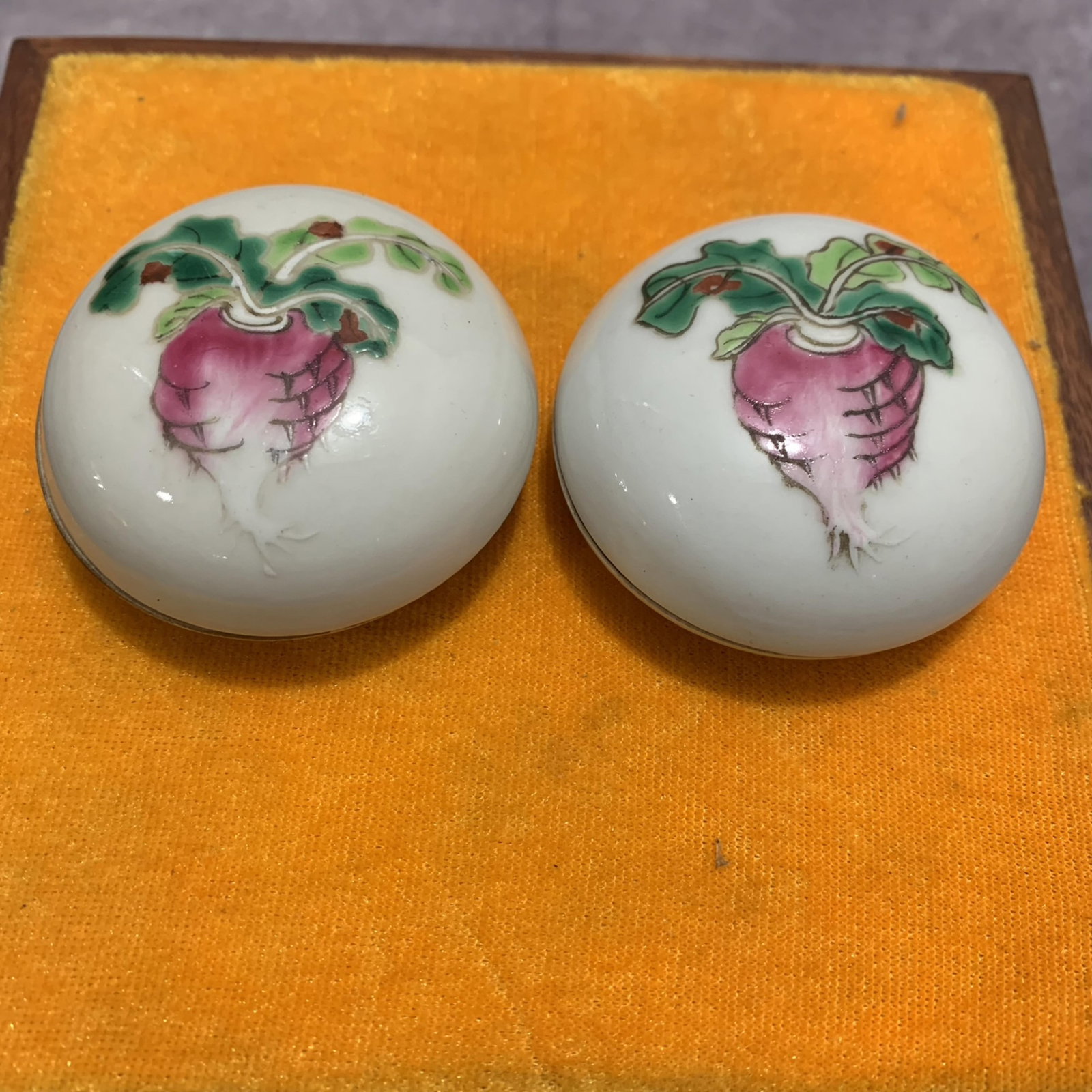 PAIR OF SMALL CARROT PAINTED PORCELAIN BOX: Qing Dynasty; Long: 1.0 inch; Width: 2.3 inch; High: 2.3 inch; wooden base for picture and display purpose only.