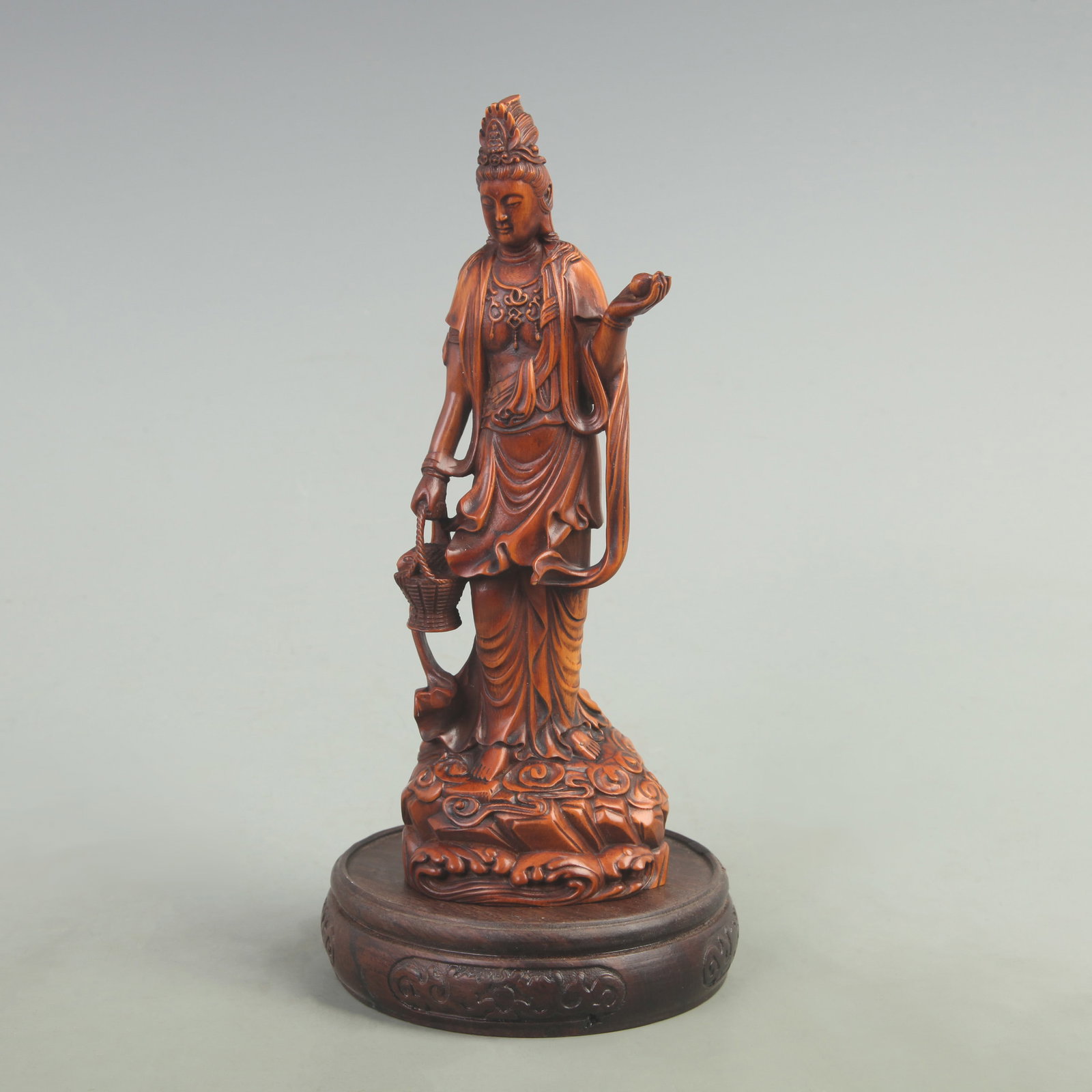 A FINELY CARVED BOXWOOD FIGURE OF GUAN YIN: 19th Century; High: 7.6 inch; Width: 2 inch; Long: 2.5 inch; wooden base for picture and display purpose only.
