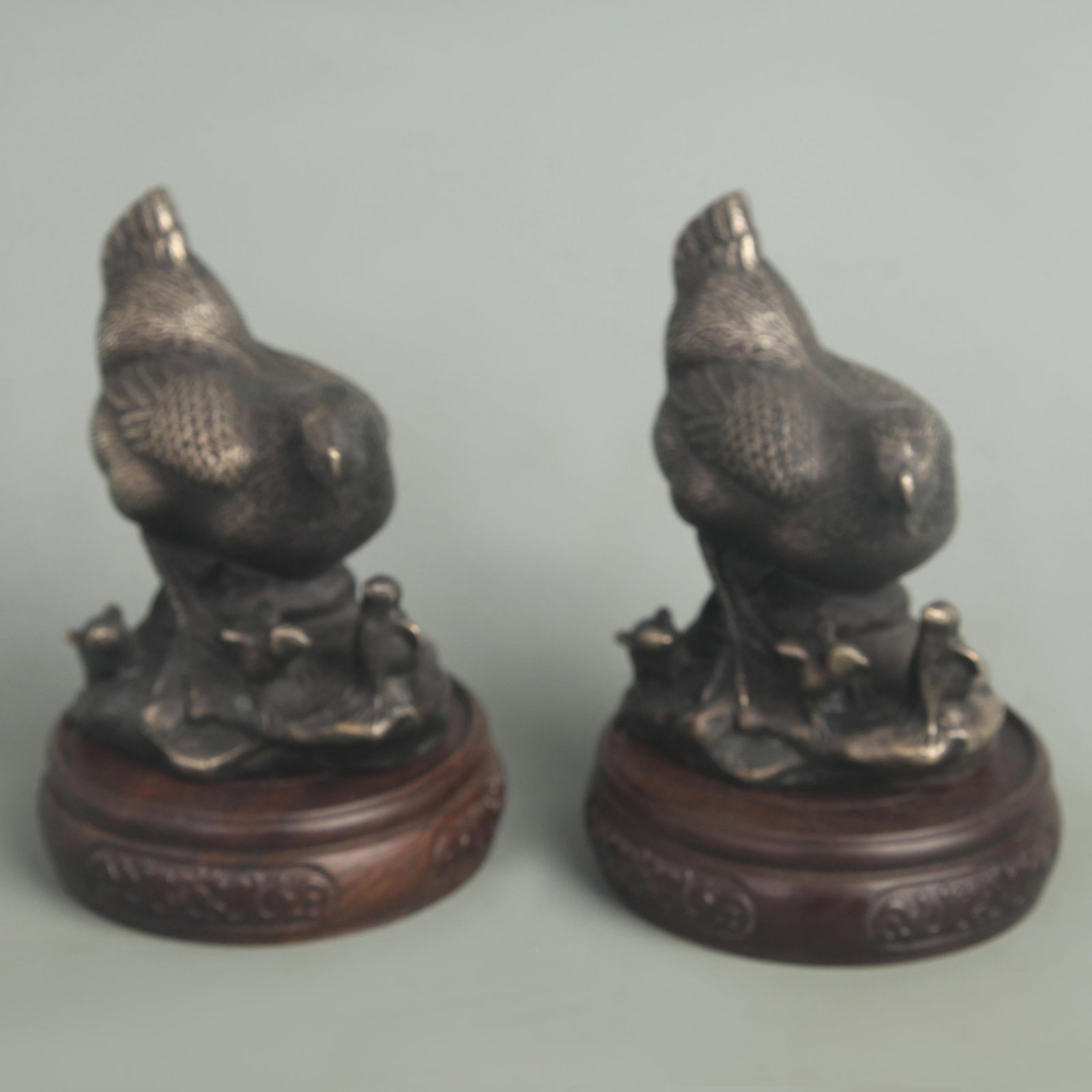 PAIR OF WHITE BRONZE BIRD FIGURINE: 20th Century; High: 4.50 inch; Width: 3.50 inch; wooden base for picture and display purpose only.