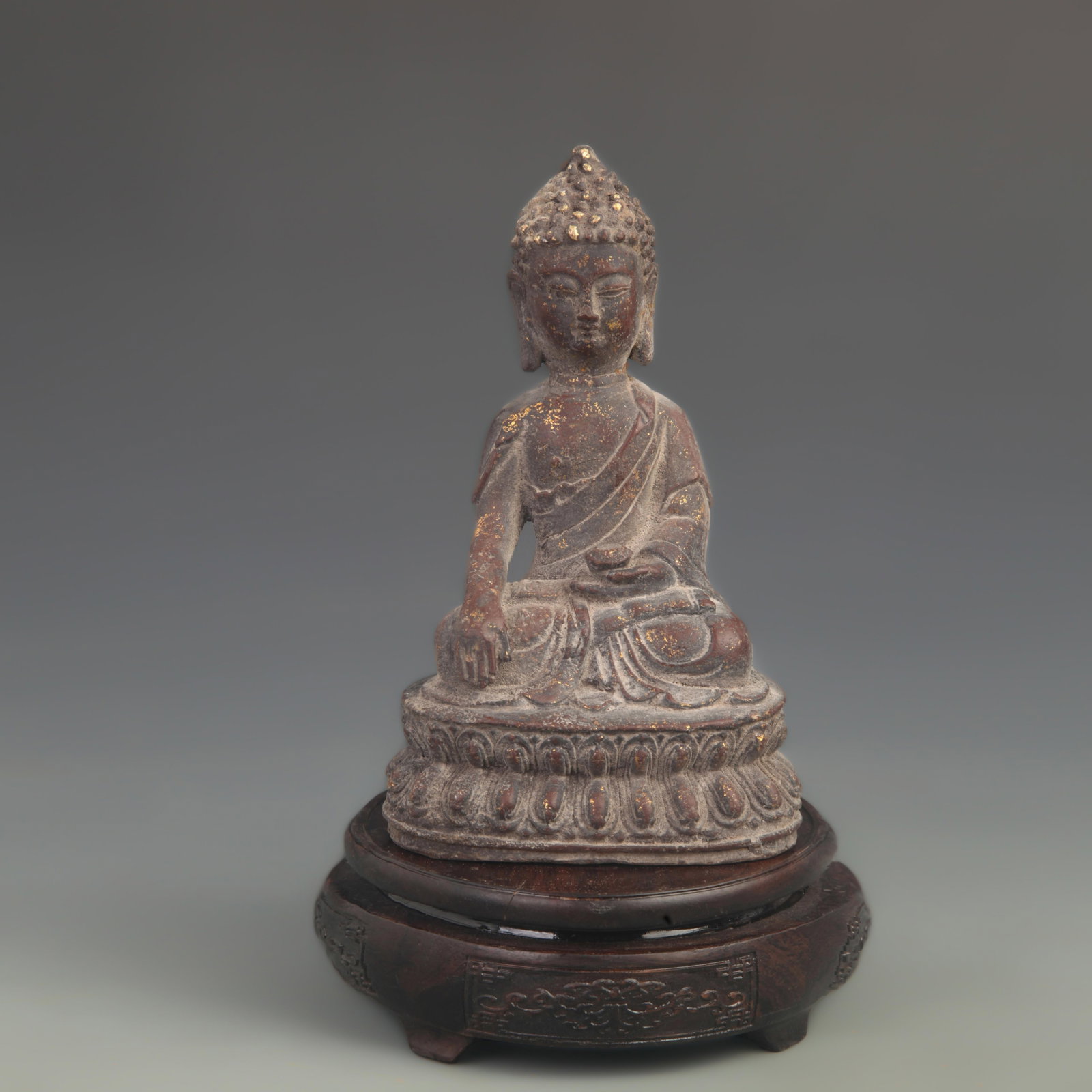 A BRONZE STATUE OF SHAKYAMUNI BUDDHA: Ming Dynasty Style; High: 7.75 inch; Width: 4.25 inch; wooden base for picture and display purpose only.