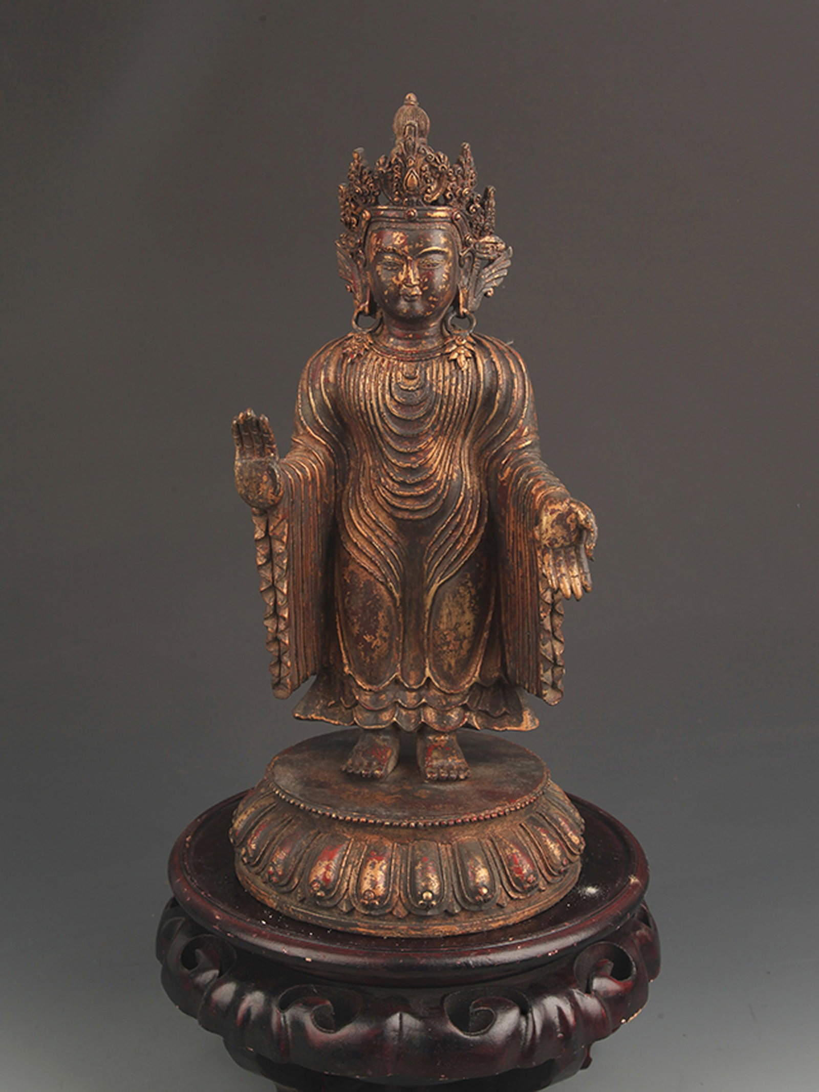 GILT-BRONZE FIGURE OF THE STANDING AMITABHA BUDDHA: Qing Dynasty; High: 13.5 inch; Width: 5.25 inch; wooden base for picture and display purpose only.