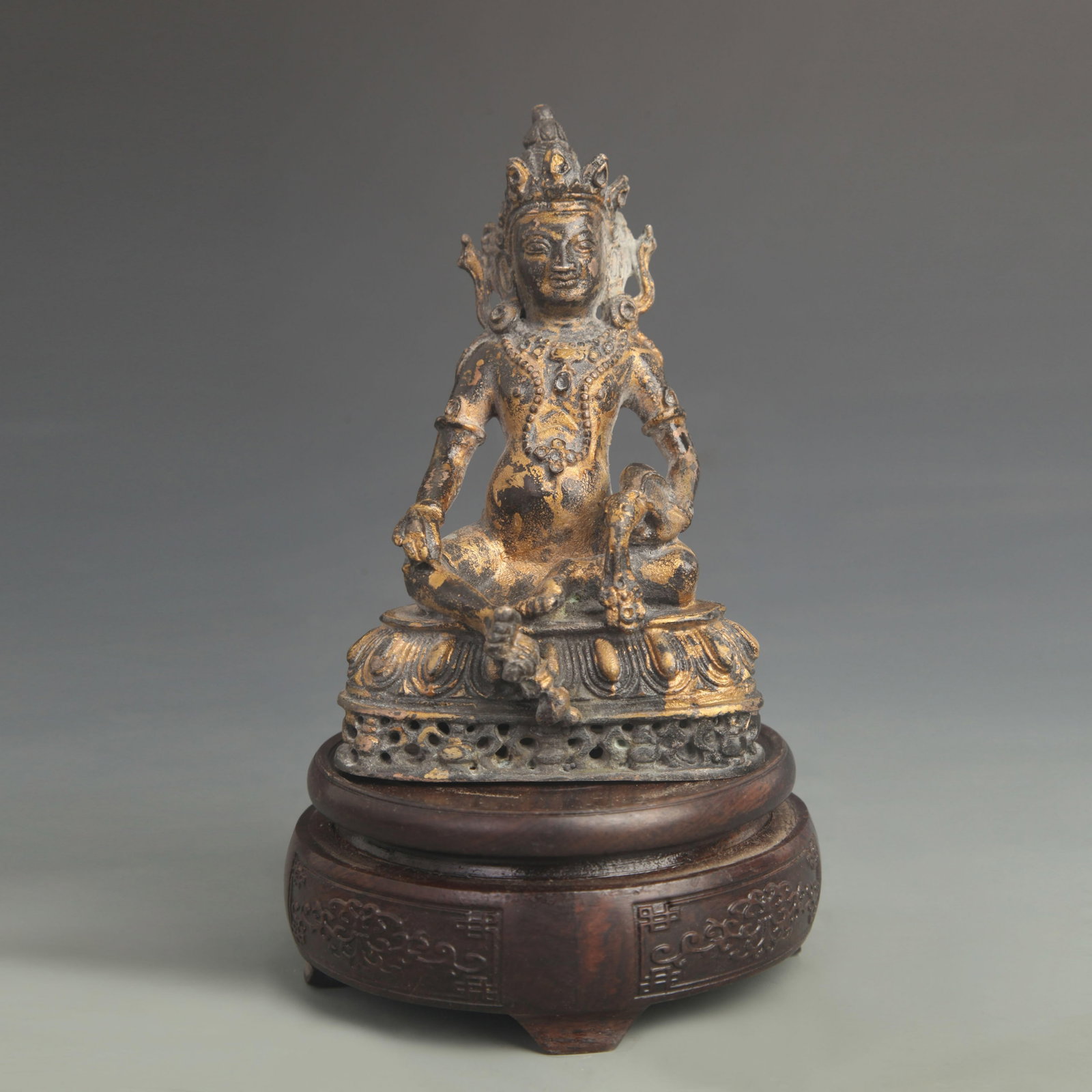A TIBETAN BUDDHIST BRONZE YELLOW JAMBHALA FIGURE WITH MONGOOSE (1 of 5)