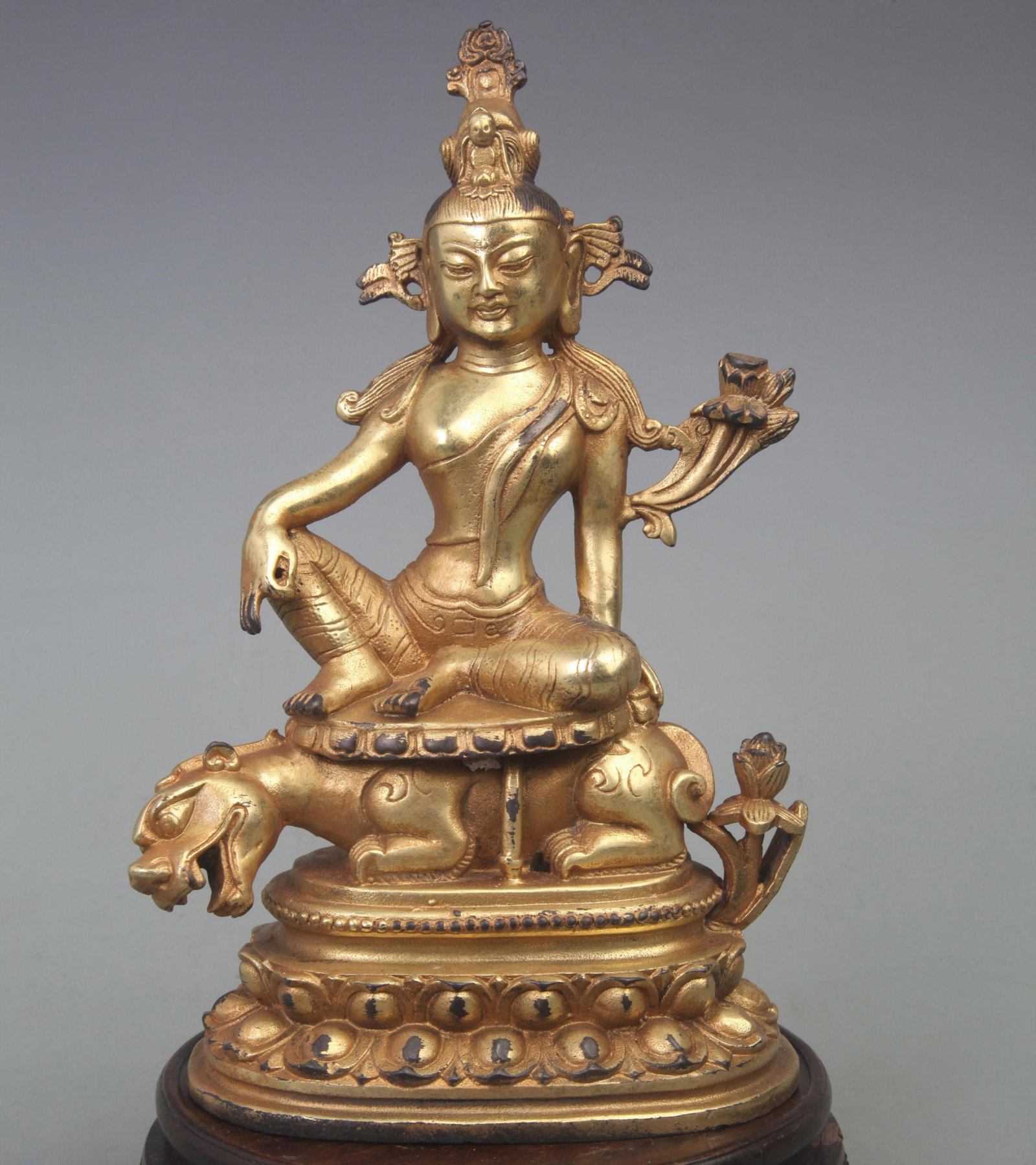 A FINE BRONZE MANJUSRI BUDDHA STATUE: Qing Dynasty, Diameter: 5.0 inch High: 8.3 inch ; wooden base for picture and display purpose only.